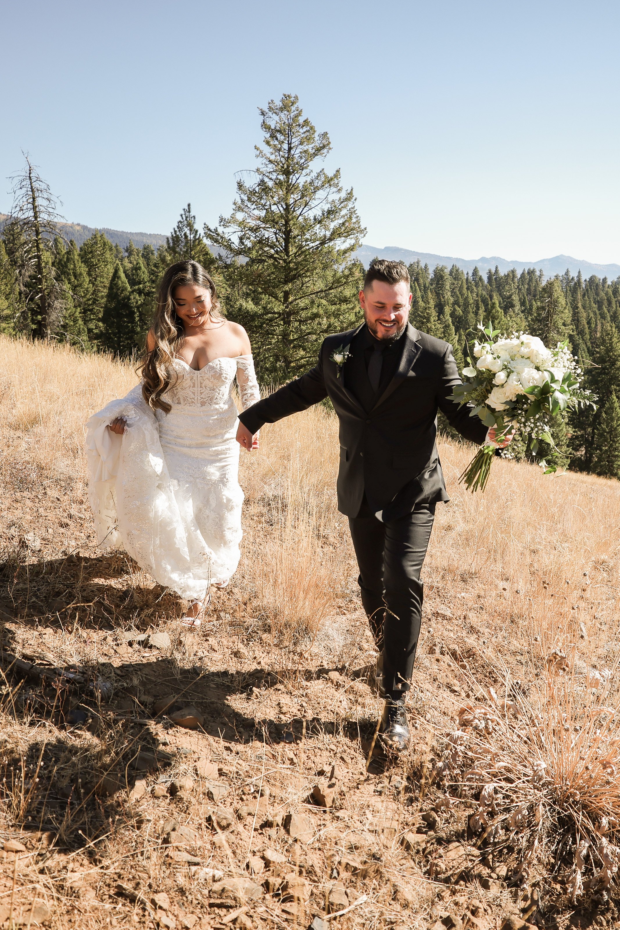Smiling Bride and groom in Mountains