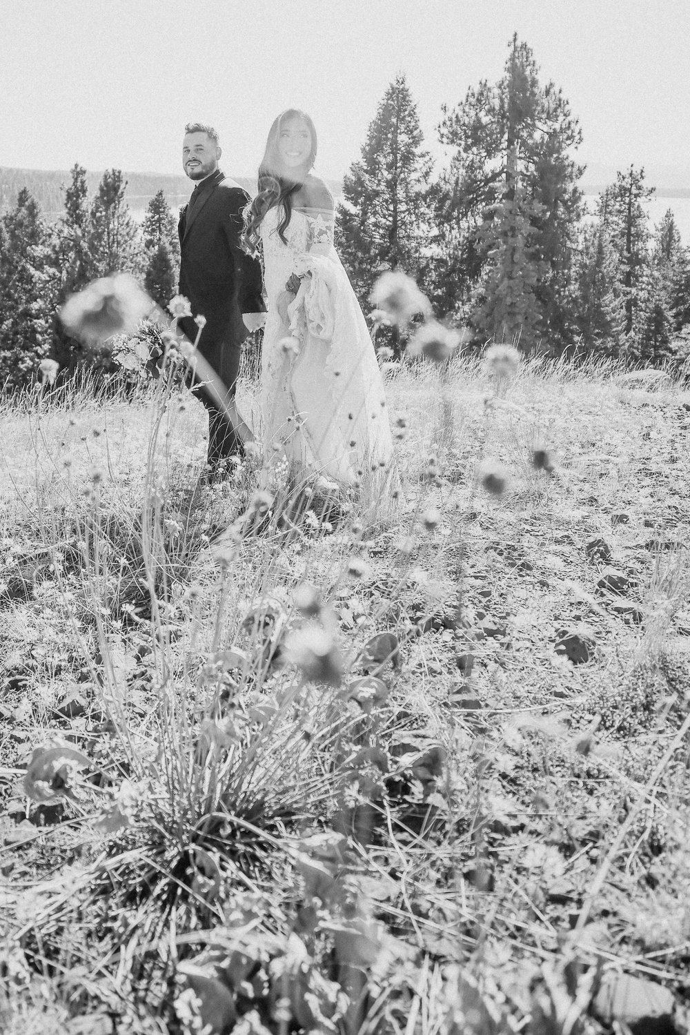 Wedding couple in Black and white with wildflowers
