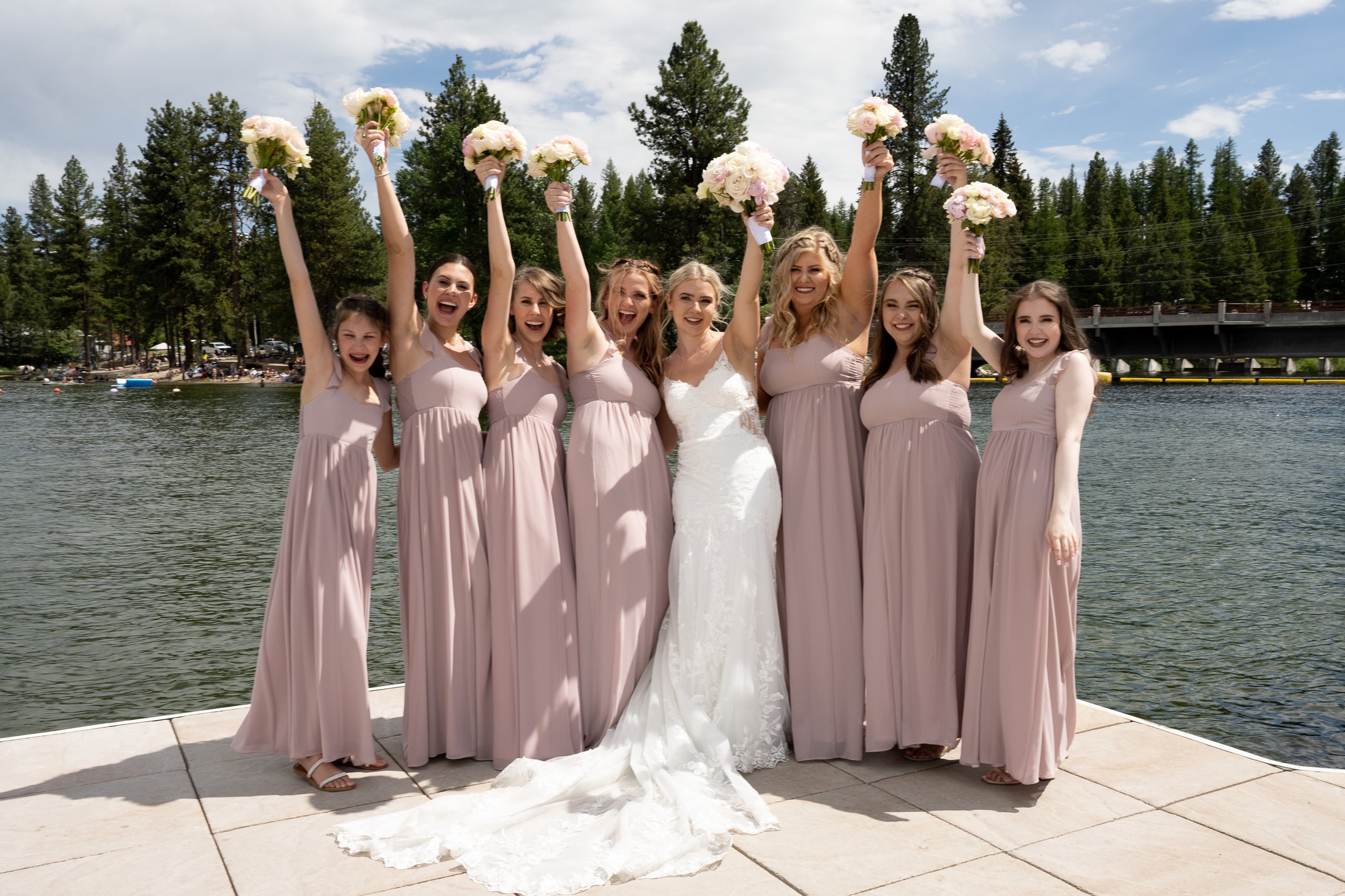 Bridesmaids with arms in air