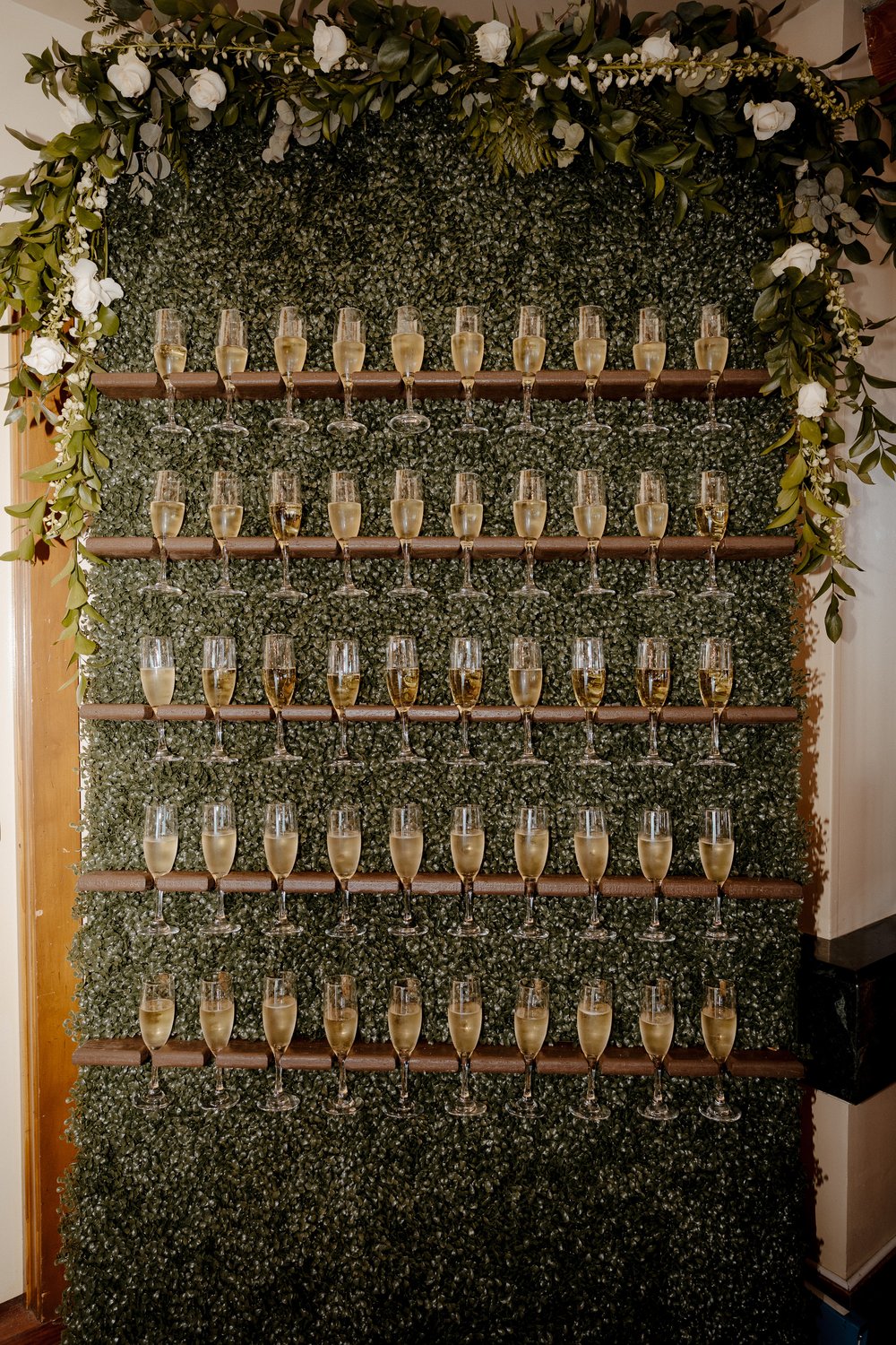 champagne wall at wedding