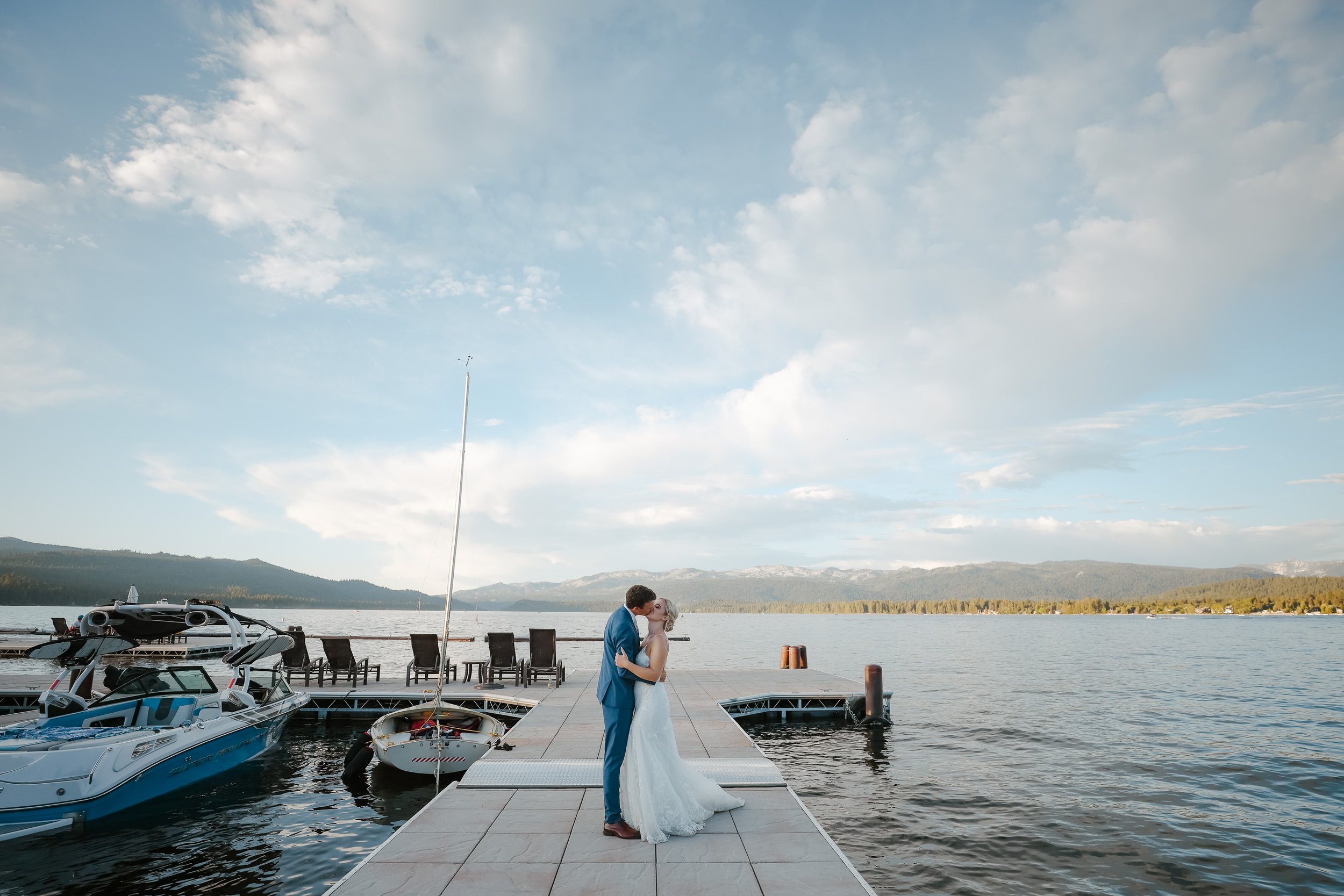 Wedding couple kiss on dock