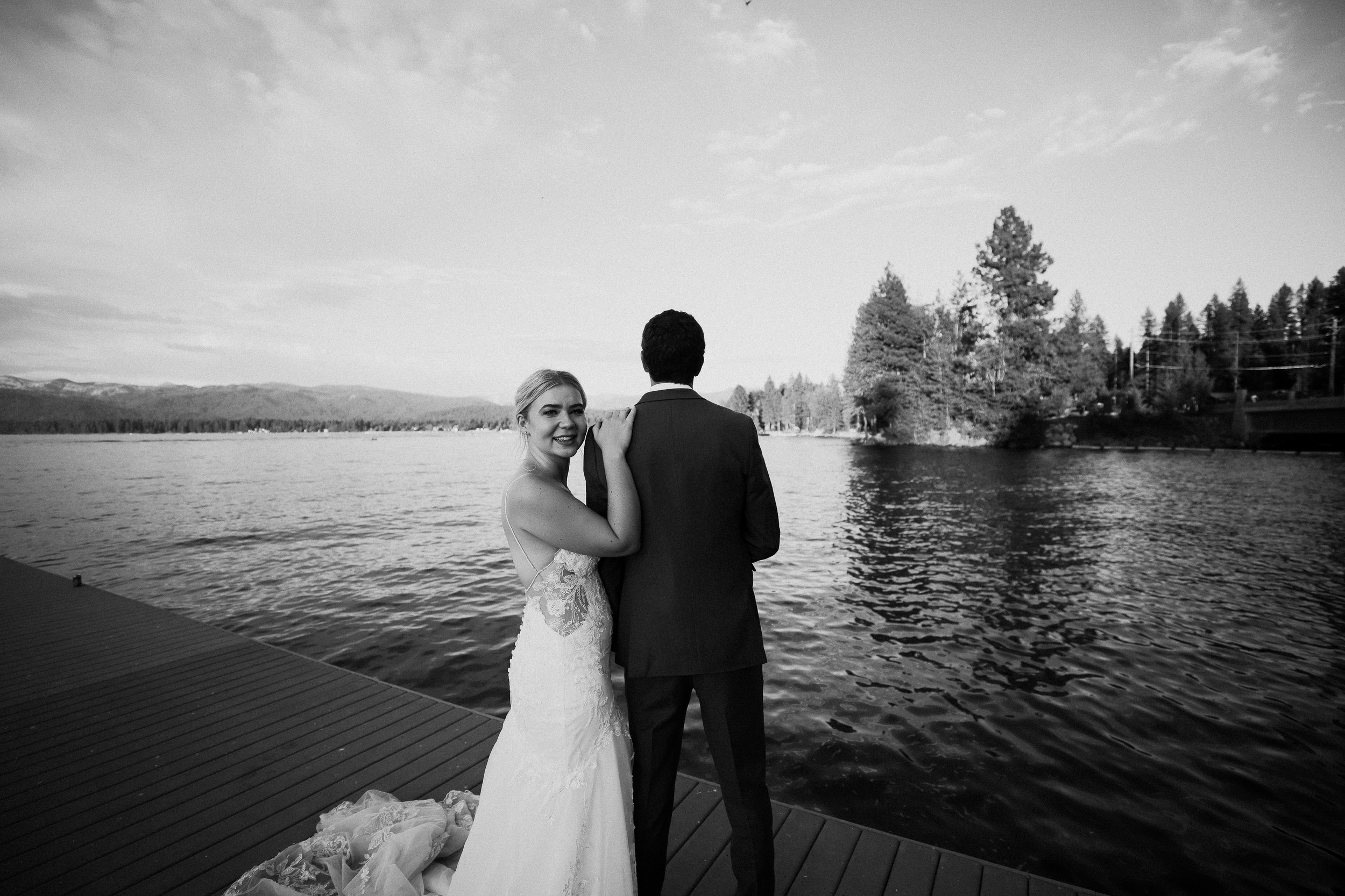 Bride and groom on dock b &amp; w