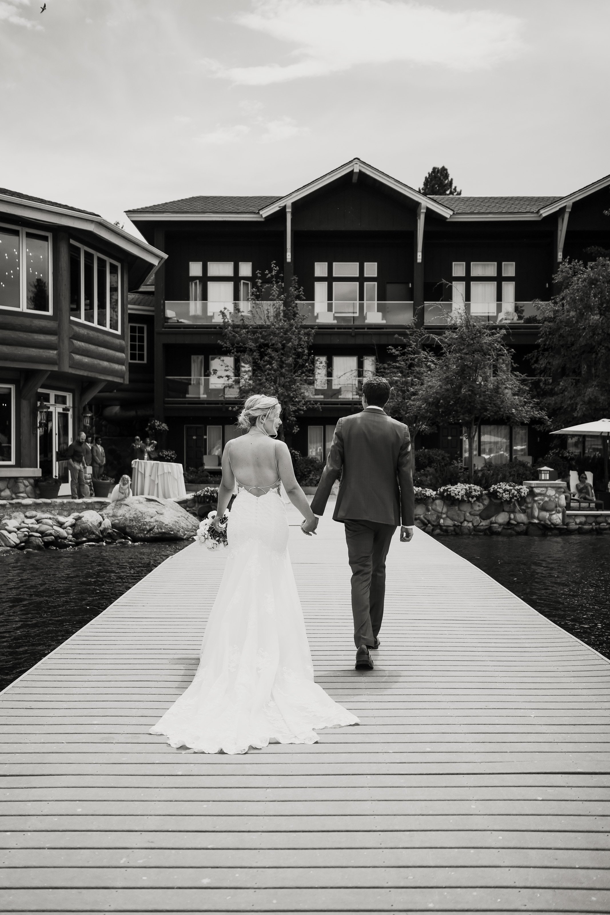 Bride and groom walk to Shore Lodge