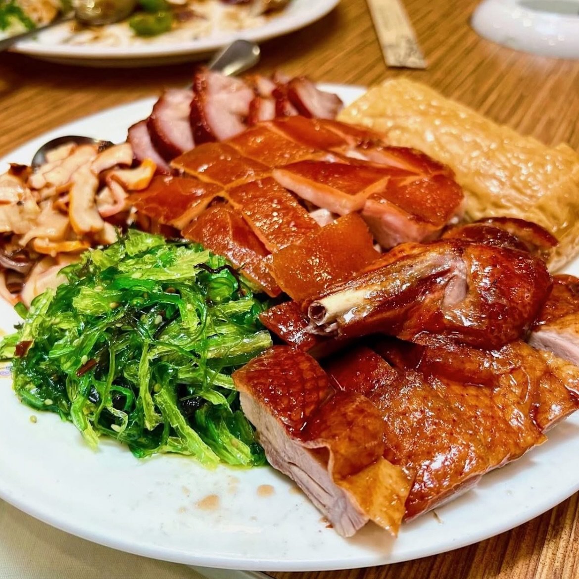 A Cantonese BBQ platter done the Koi Palace way &mdash; crackling roast duck, glossy char siu, soy-poached chicken, and of course, our crispy pork belly, all on one plate. A banquet-style classic for good reason. Roasted fresh, carved to order, best 