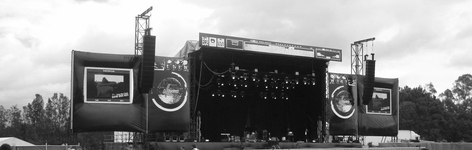 Screens at the V festival Australia that fans could send images to using the MMS function of feature phones, 2007. 