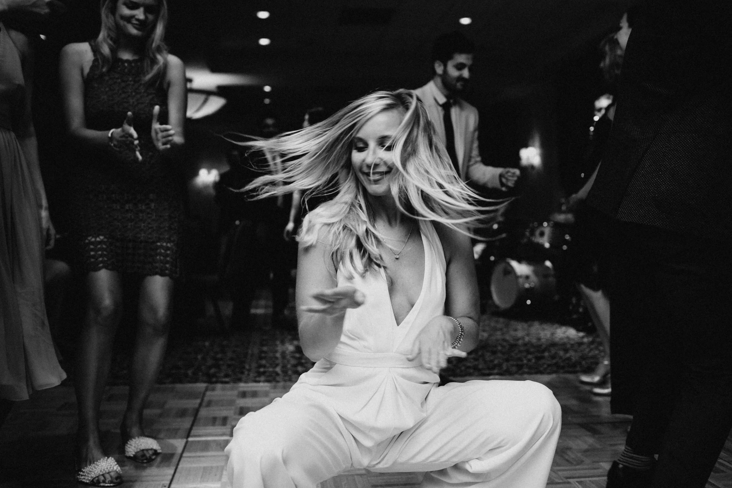 Photo of bride dancing at wedding rehearsal.