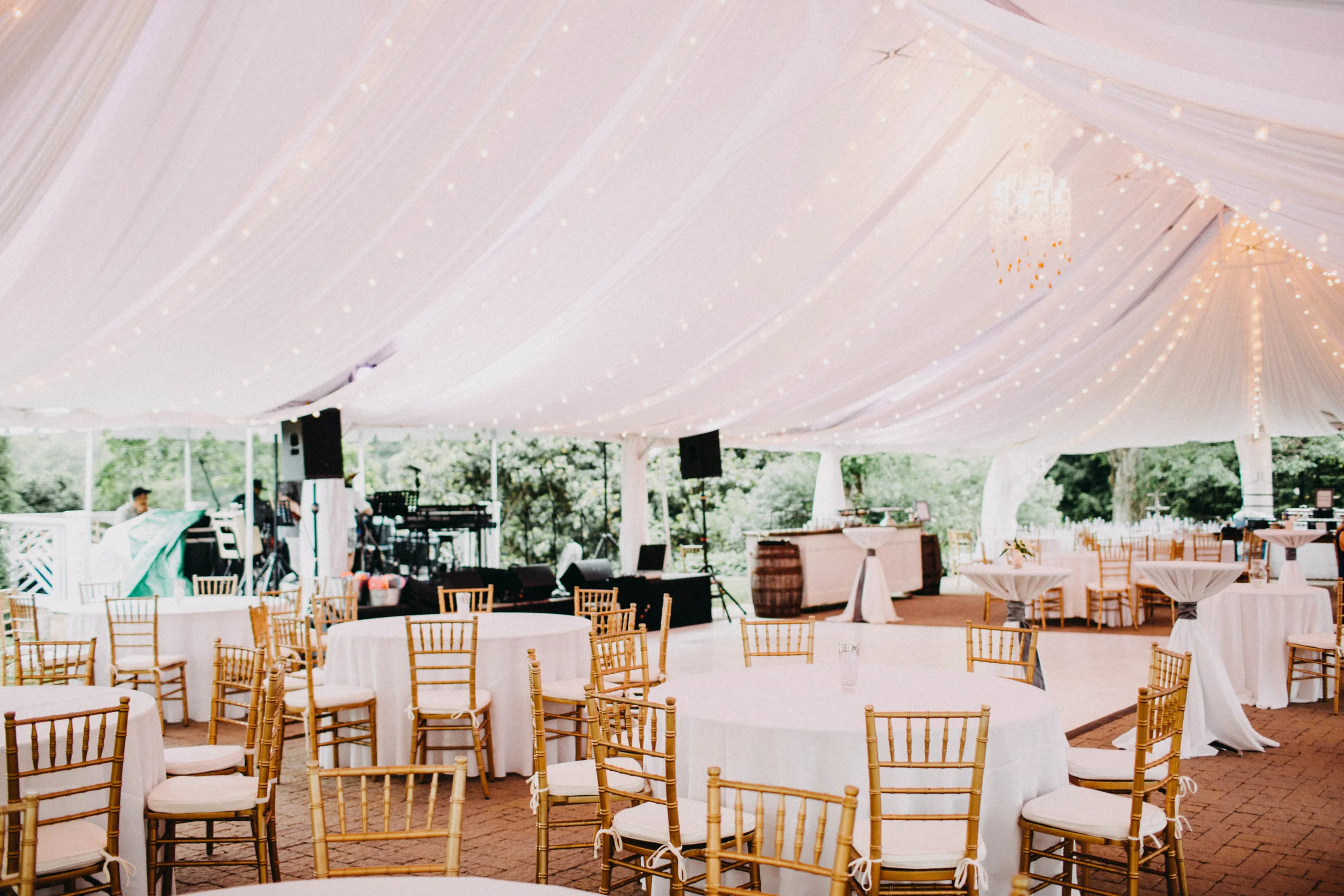 Photo of wedding reception under white tent, at Sundara wedding venue, VA.