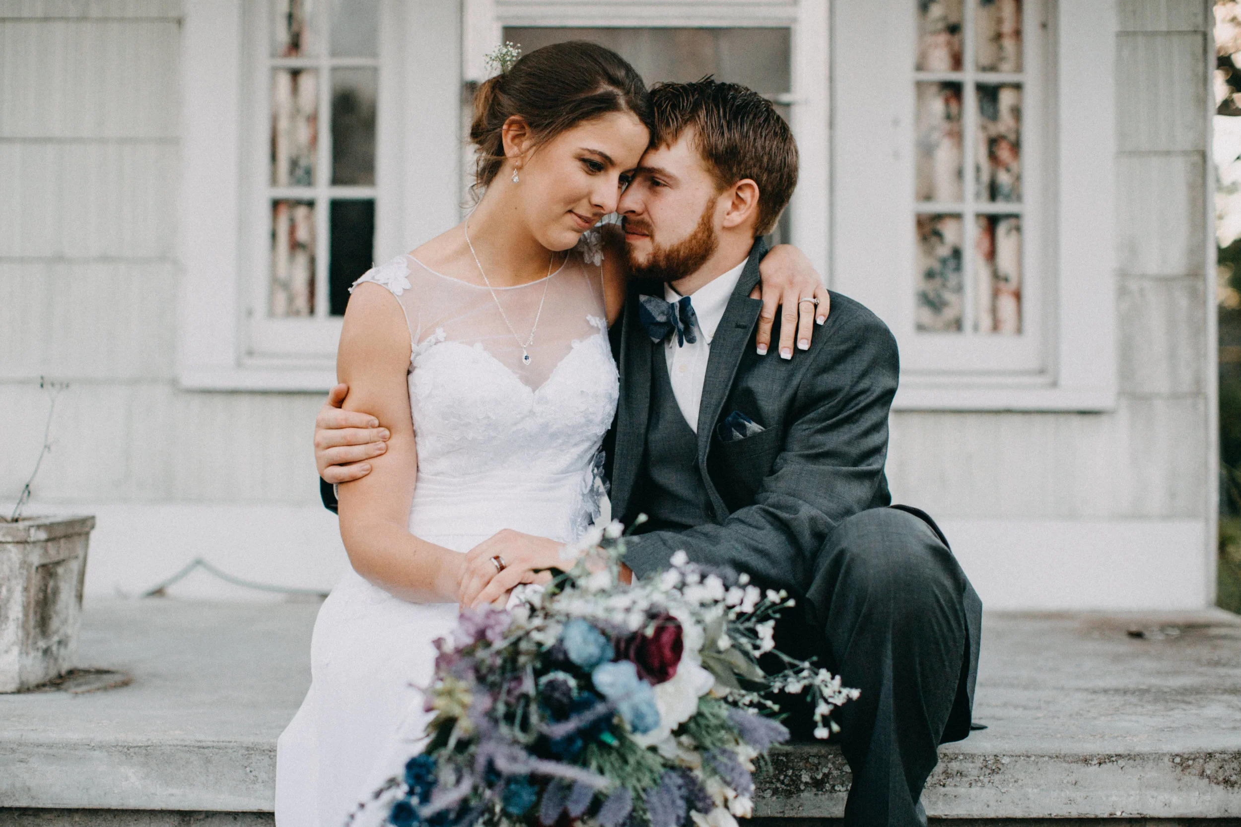 Portrait of couple sitting together on porch, in Lutz, FL.