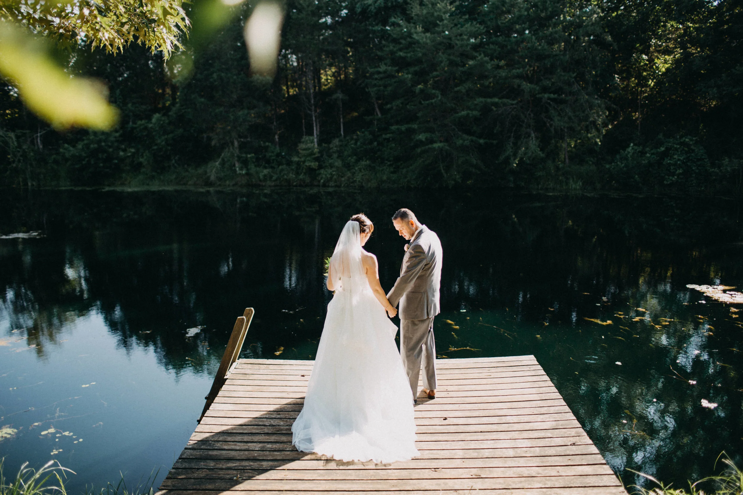 Photo of couple standing together on dock.
