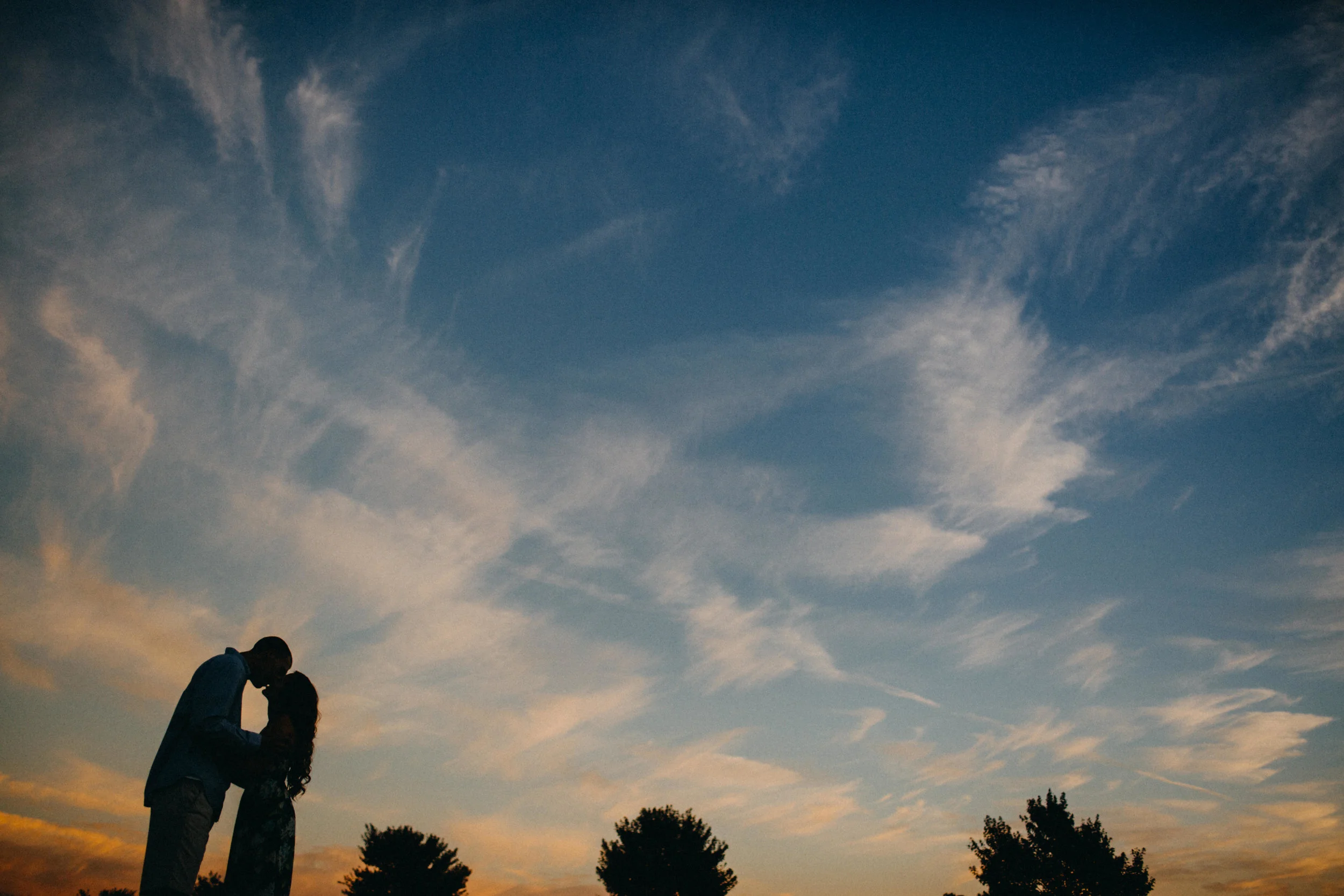 Silhouette of couple at sunset.