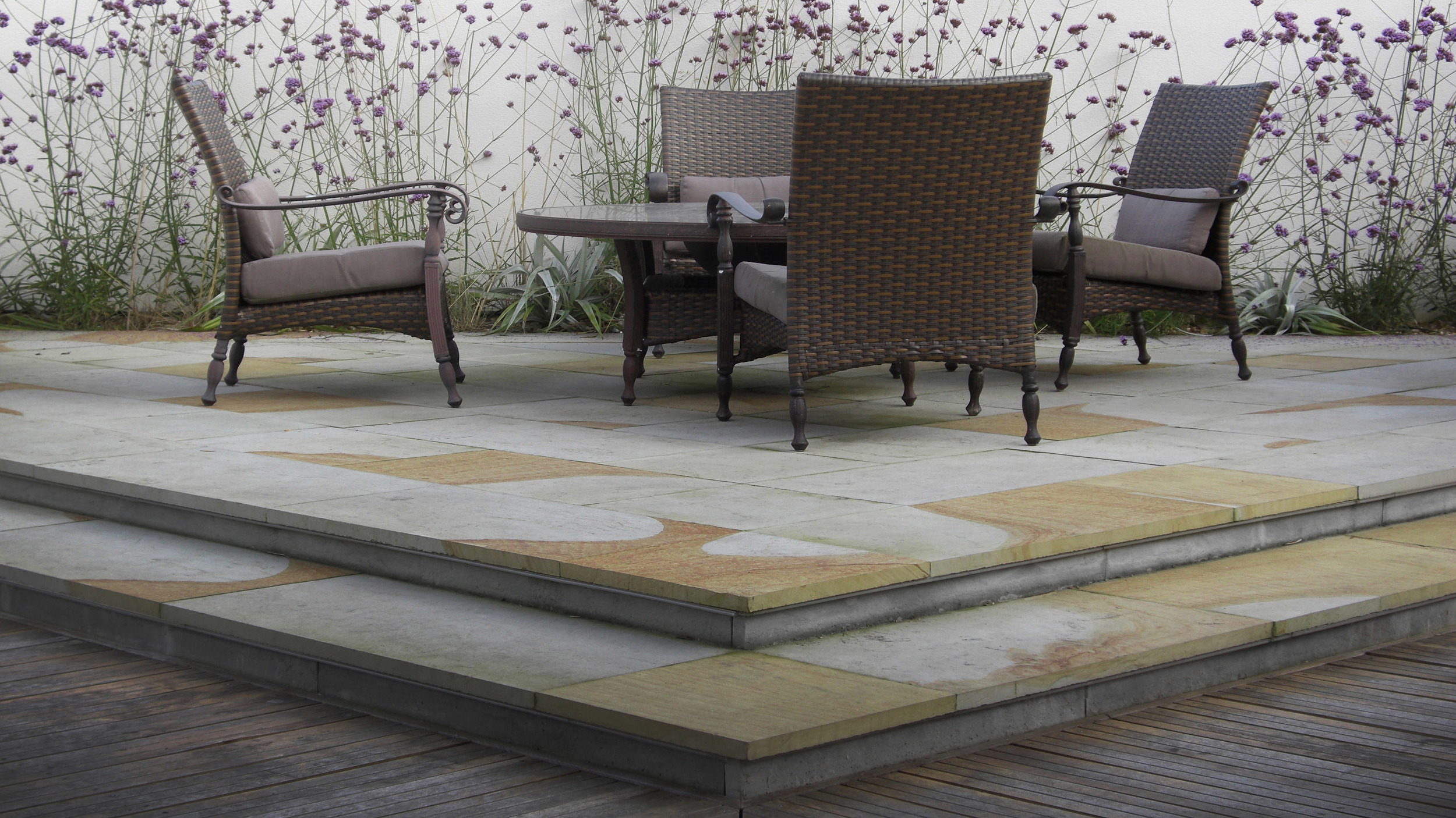 Outdoor relaxation area with sandstone paving