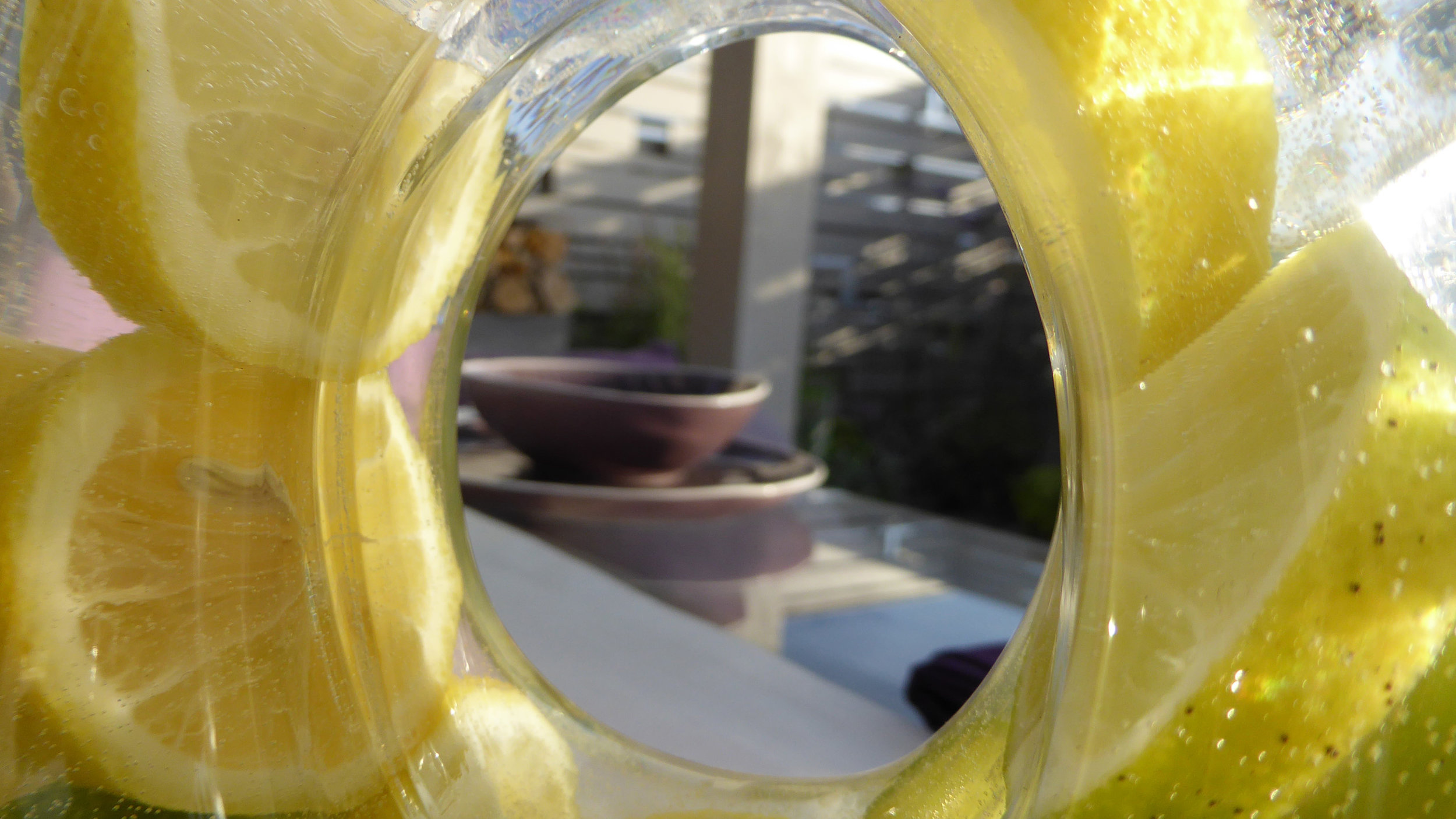 Southport Garden Design: A View Of The Olive Tree: Water Jug With Lemon Slices And Seating Area