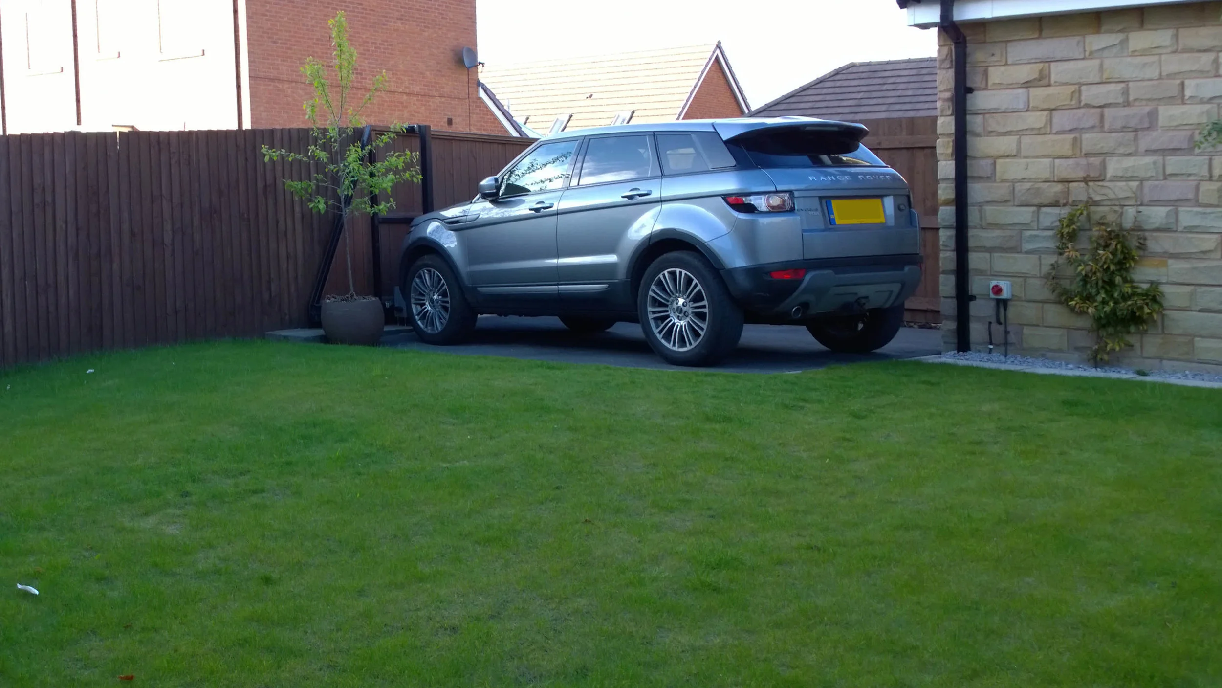 BEFORE - Open aspect with no interest and visible car port.
