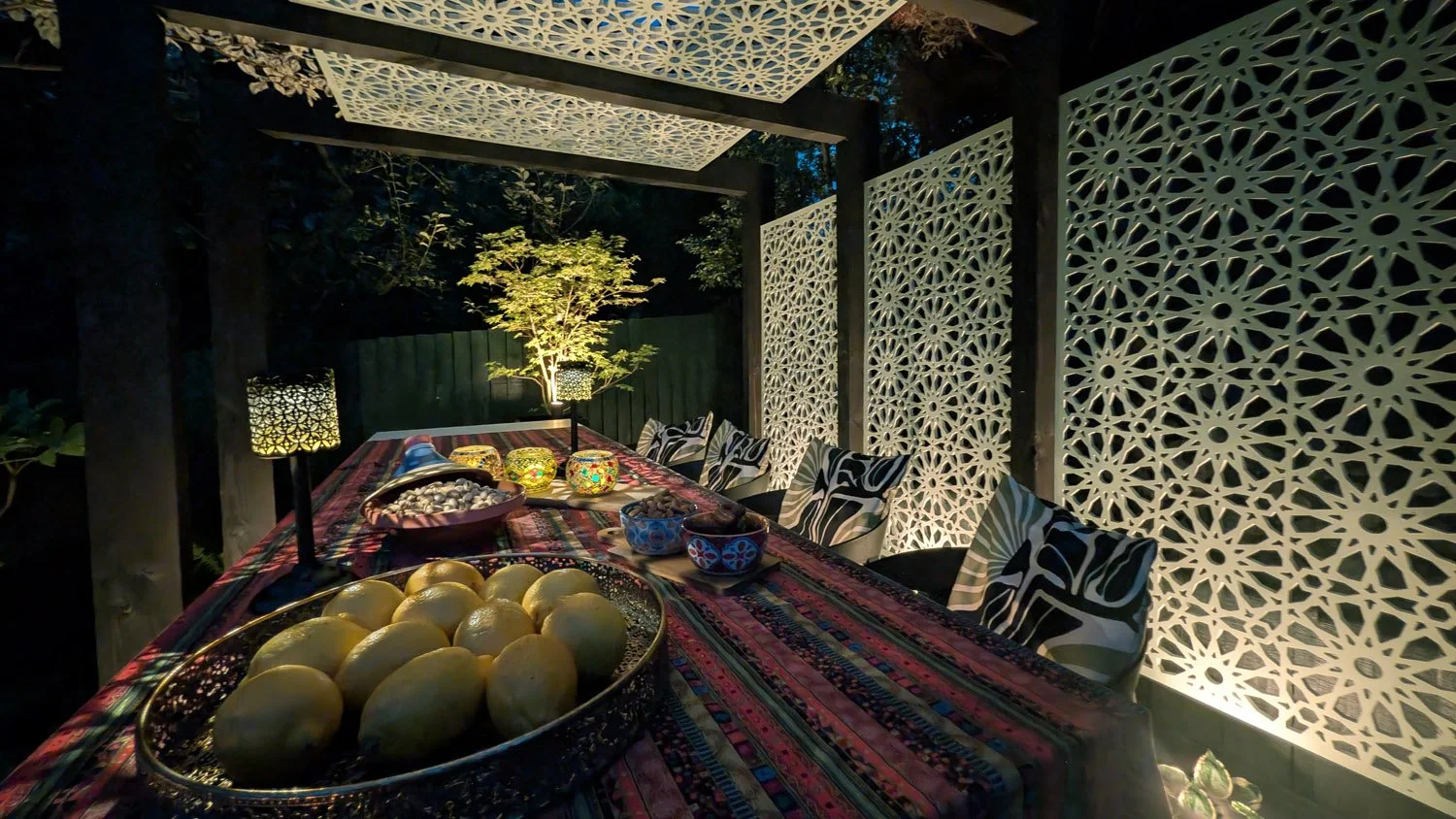 Illuminated Pergola Dining Area at Night