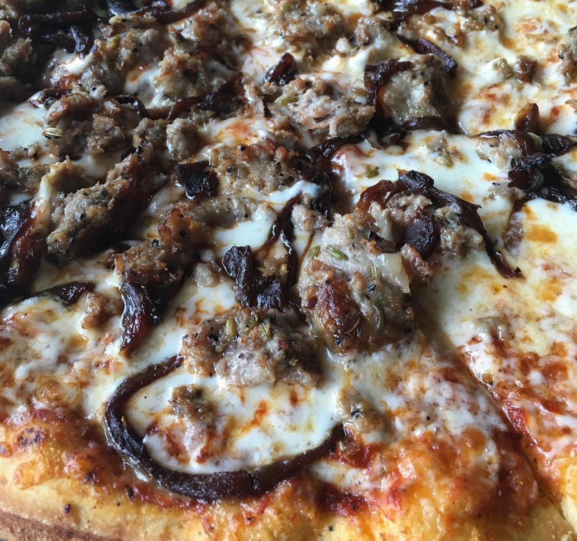 sausage and caramelized onion pizza at bench