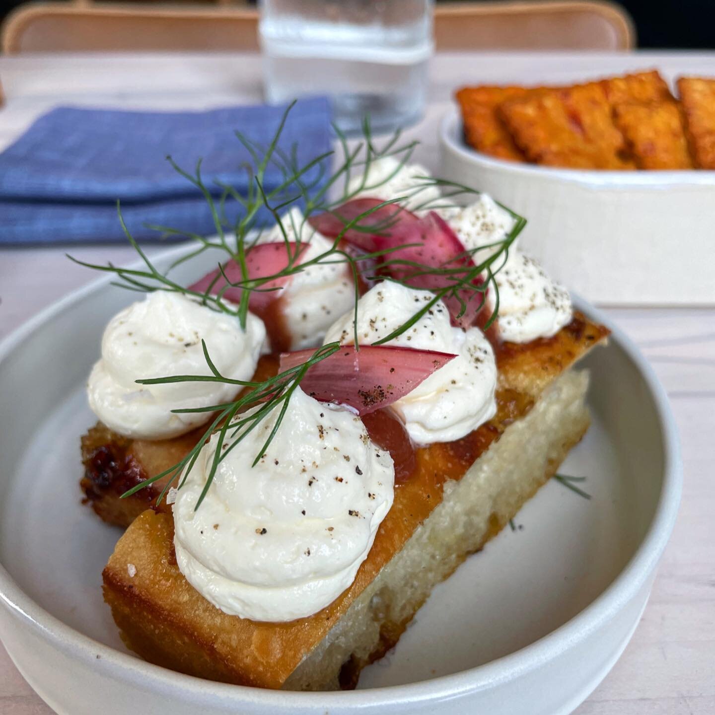 Congrats to @dan_kluger on the opening of @greywind_nyc! This house-made focaccia with rhubarb and ricotta was just the perfect spring bite. Can&rsquo;t wait to make my way through the whole menu.