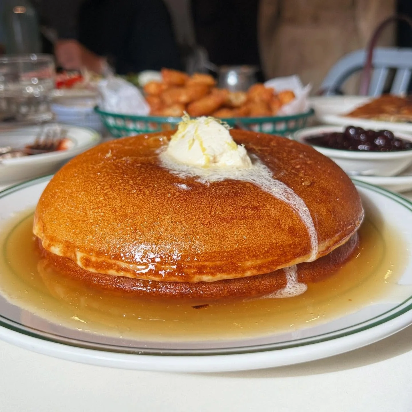 Perhaps the most perfect pancakes in the world. Behold @goldendinerny&rsquo;s fluffy, honey butter-drizzled stack.