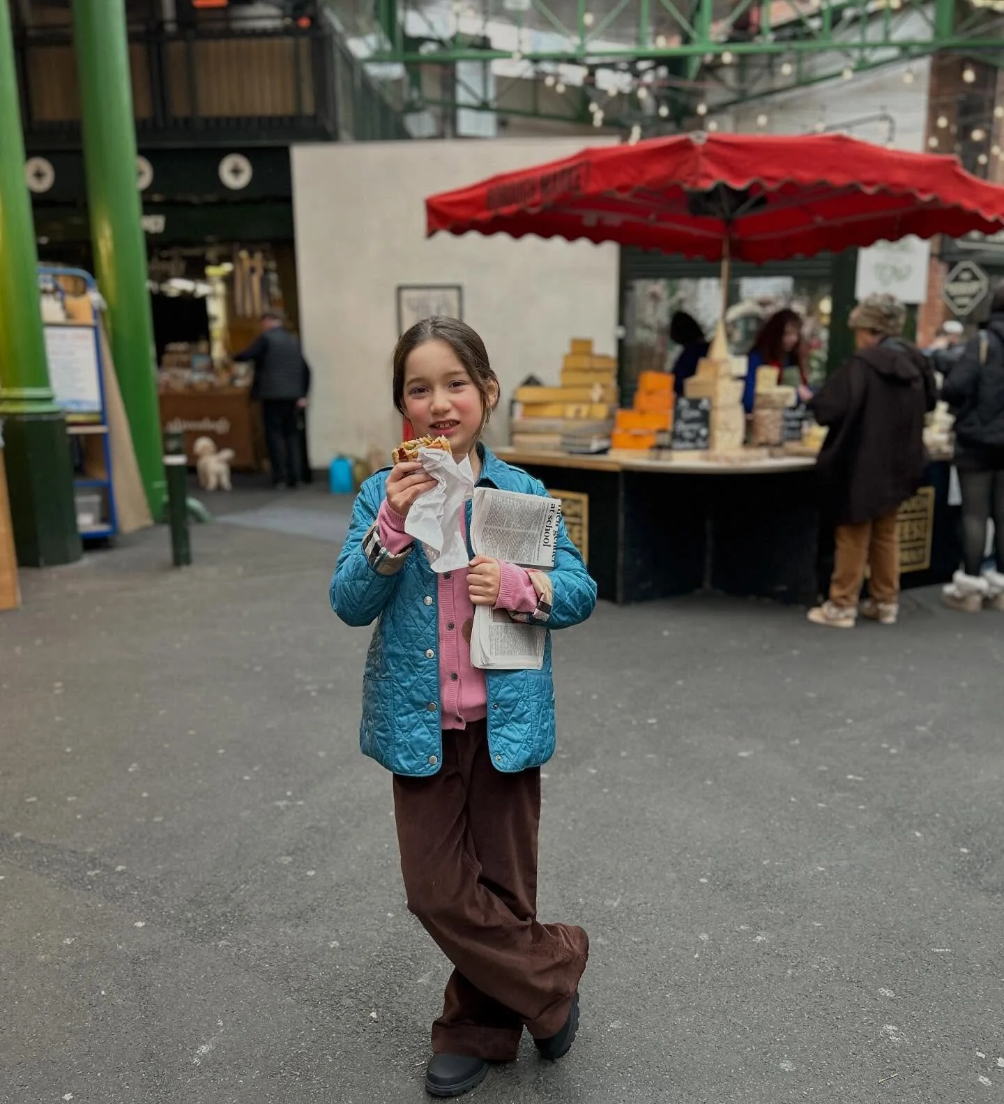 London Avvie: paper and pasty in hand at Borough Market.