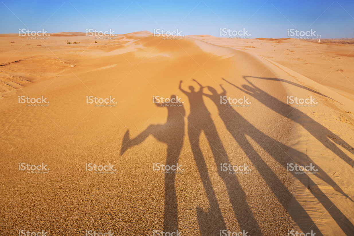 Friends having fun in the desert (Example Caption)