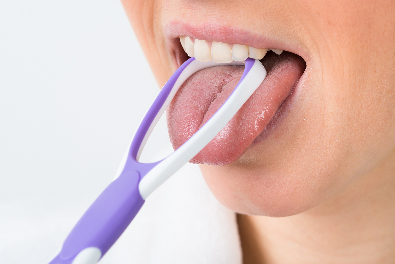 bigstock-woman-using-tongue-cleaner-89417300 (1).jpg