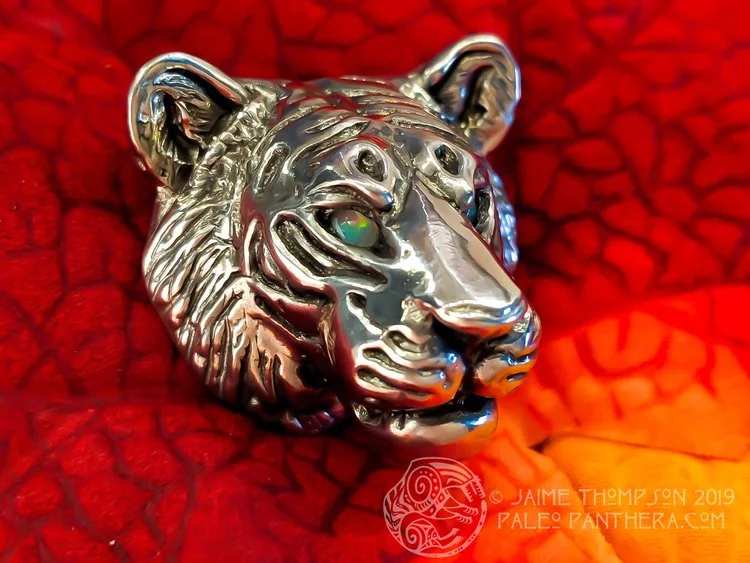 Tiger pendant with Ethiopian opal eyes.