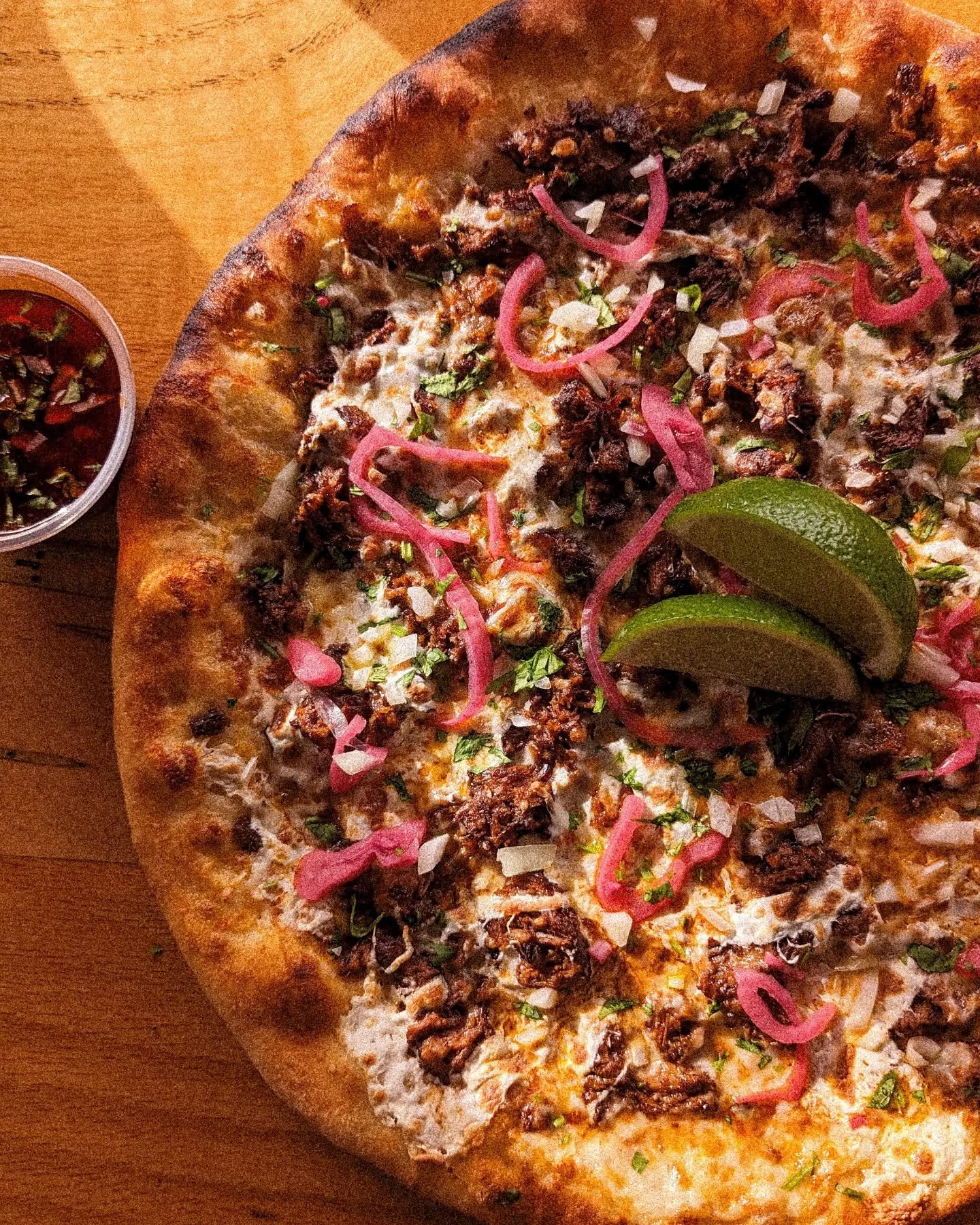surprise💃
.
.

introducing our spring lineup 🌱 available 𝘁𝗼𝗺𝗼𝗿𝗿𝗼𝘄 𝗻𝗶𝗴𝗵𝘁!

first up➝🌮 it's birria, b*tch
birria beef, oaxaca cheese, mozz and a drizzle of consumm&eacute;. you'll get a side of diced onions, pickled onions, cilantro and