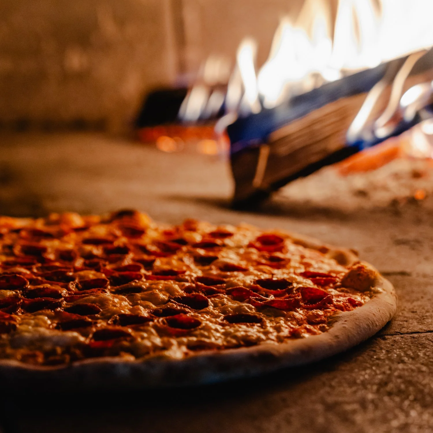 Wood-fired pepperoni pizza fresh out of the oven at One6Three in East Rock, New Haven