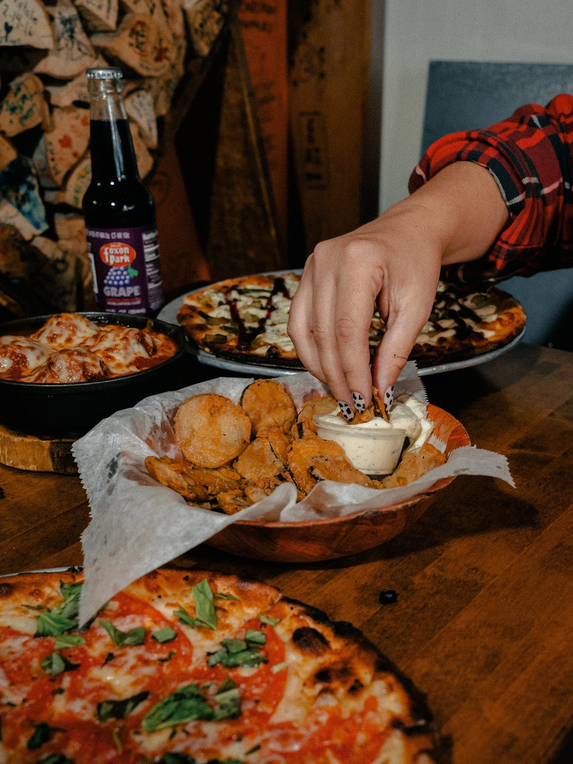 Dipping fried pickles into house-made ranch, with pizza, meatballs & Foxon Park soda at One6Three in East Rock