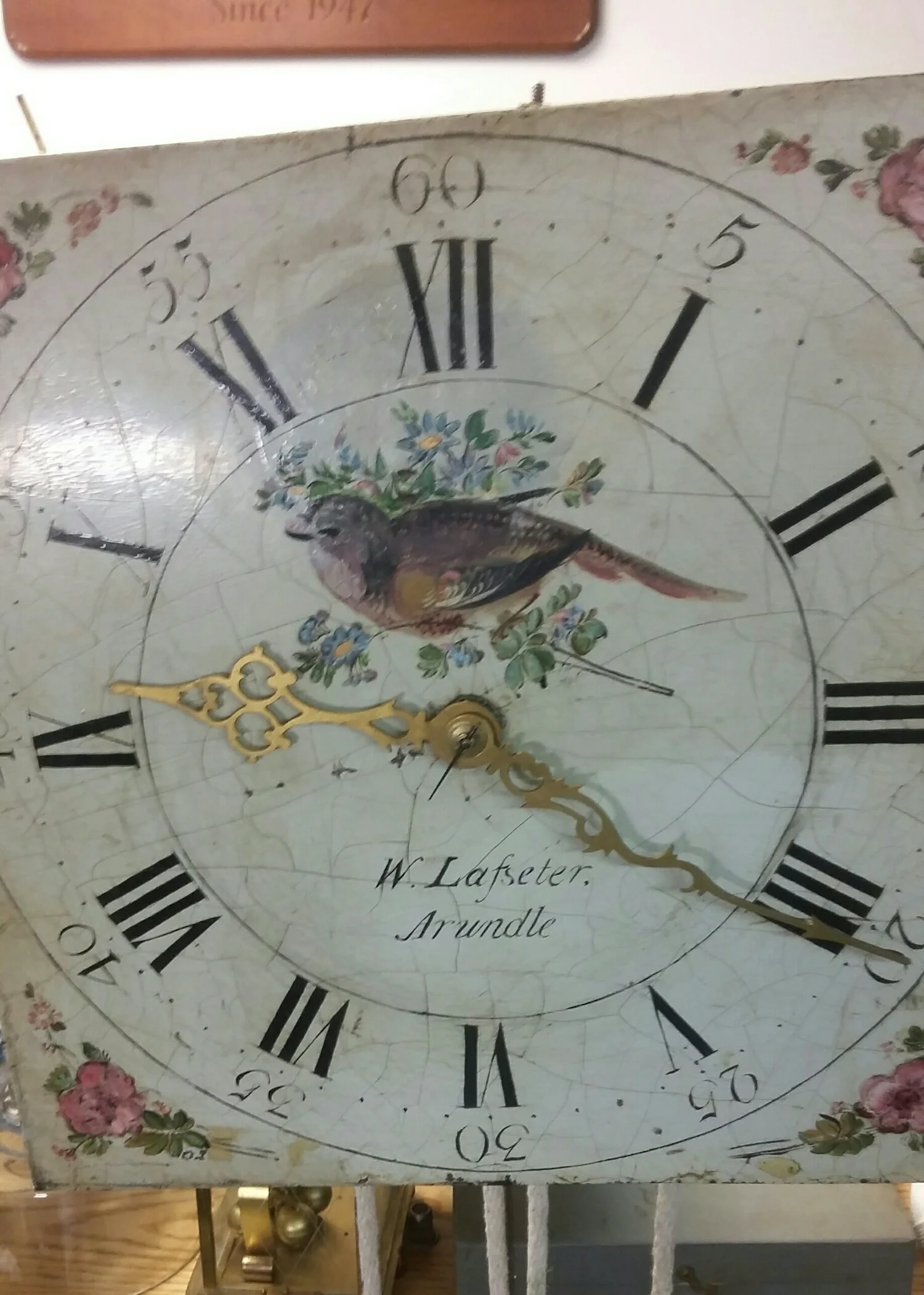 This is an antique grandfather clock dial that is on a rope driven movent with one weight that drives two gear trains .It only runs for one day per Winding .