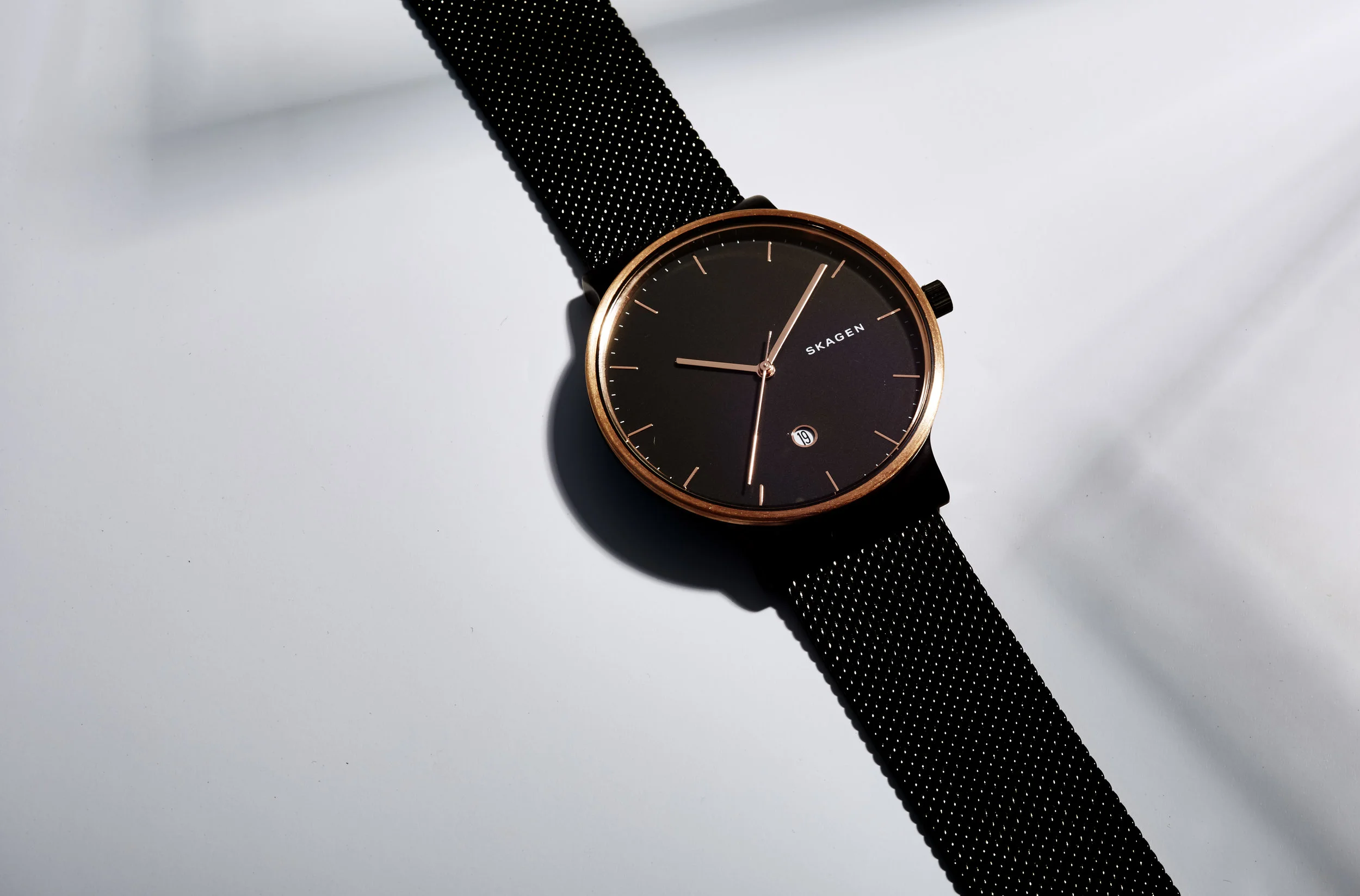  Skagen Watch resting in shadows. Still Life Photograph by London Based Still Life Photographer Andy Carson. 