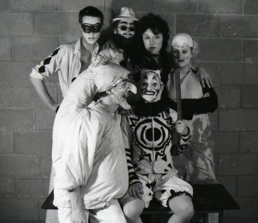 Backstage at A Clowns' Sodom , 1976. Back row: Clive Barker, Doug Bradley, Peter Atkins, Julie Blake. Front row: Philip Rimmer, Lynne Darnell.