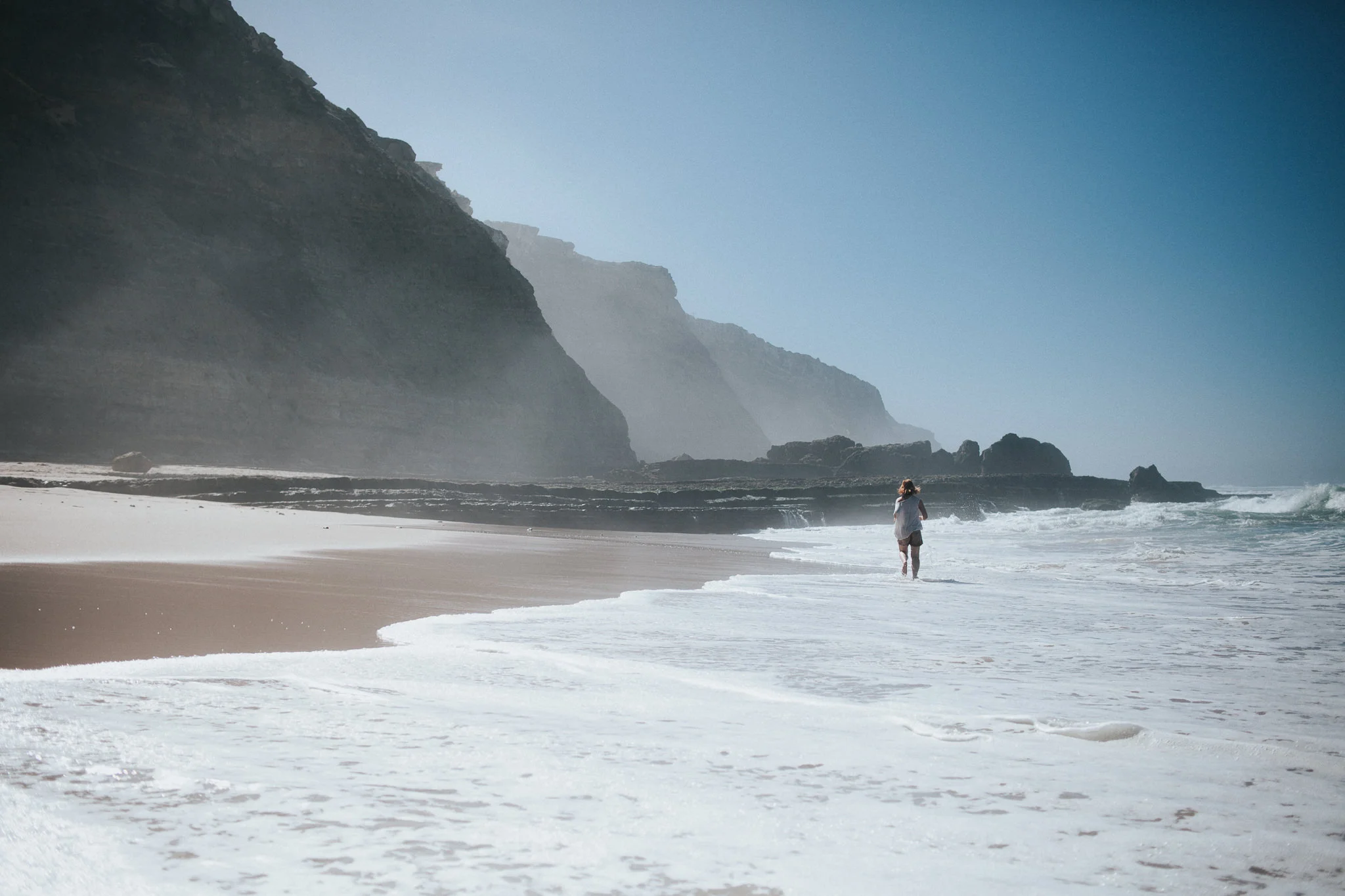 Woman walking on the beach