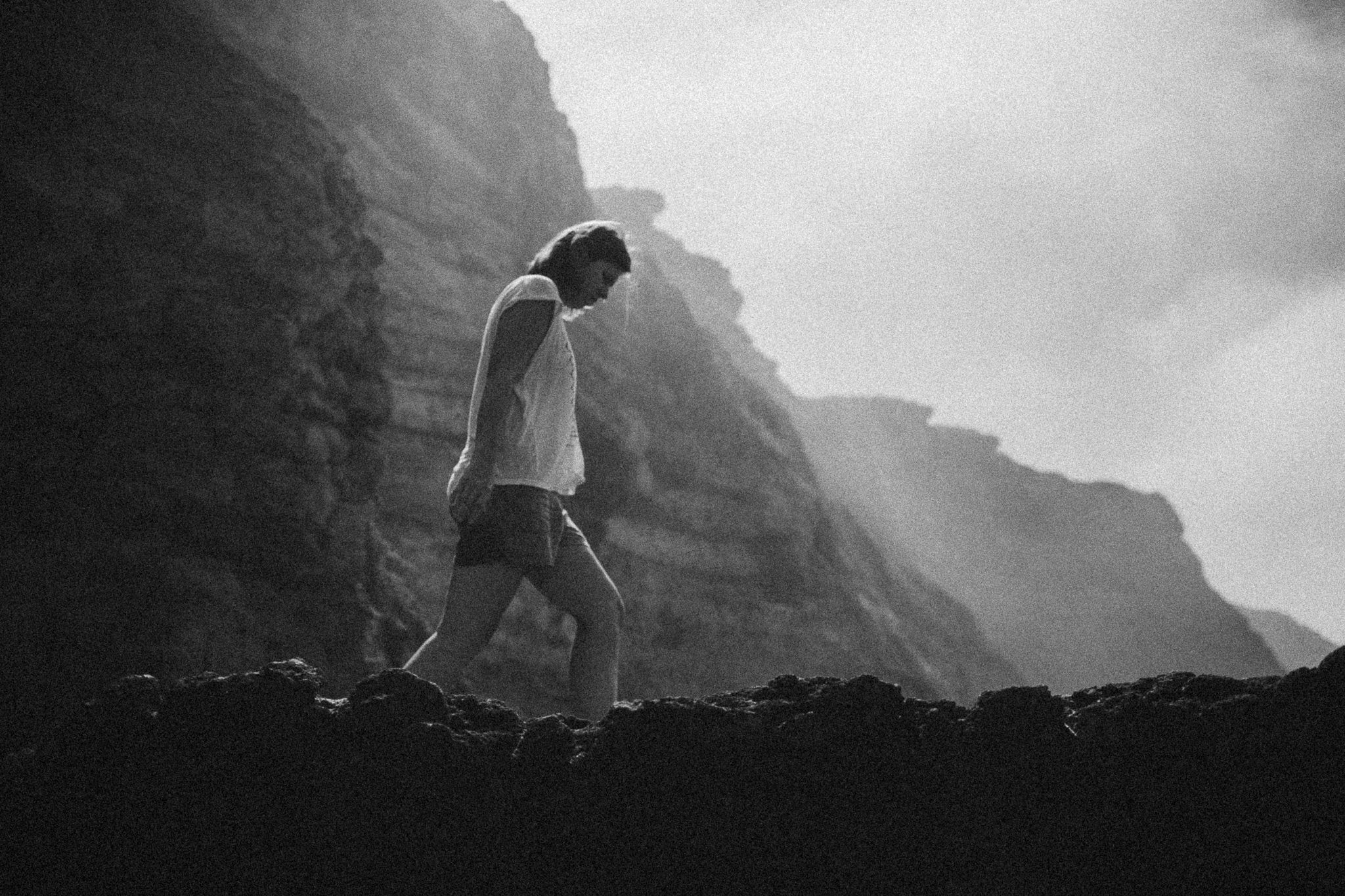 Woman-walking-on-the-rocks.jpg