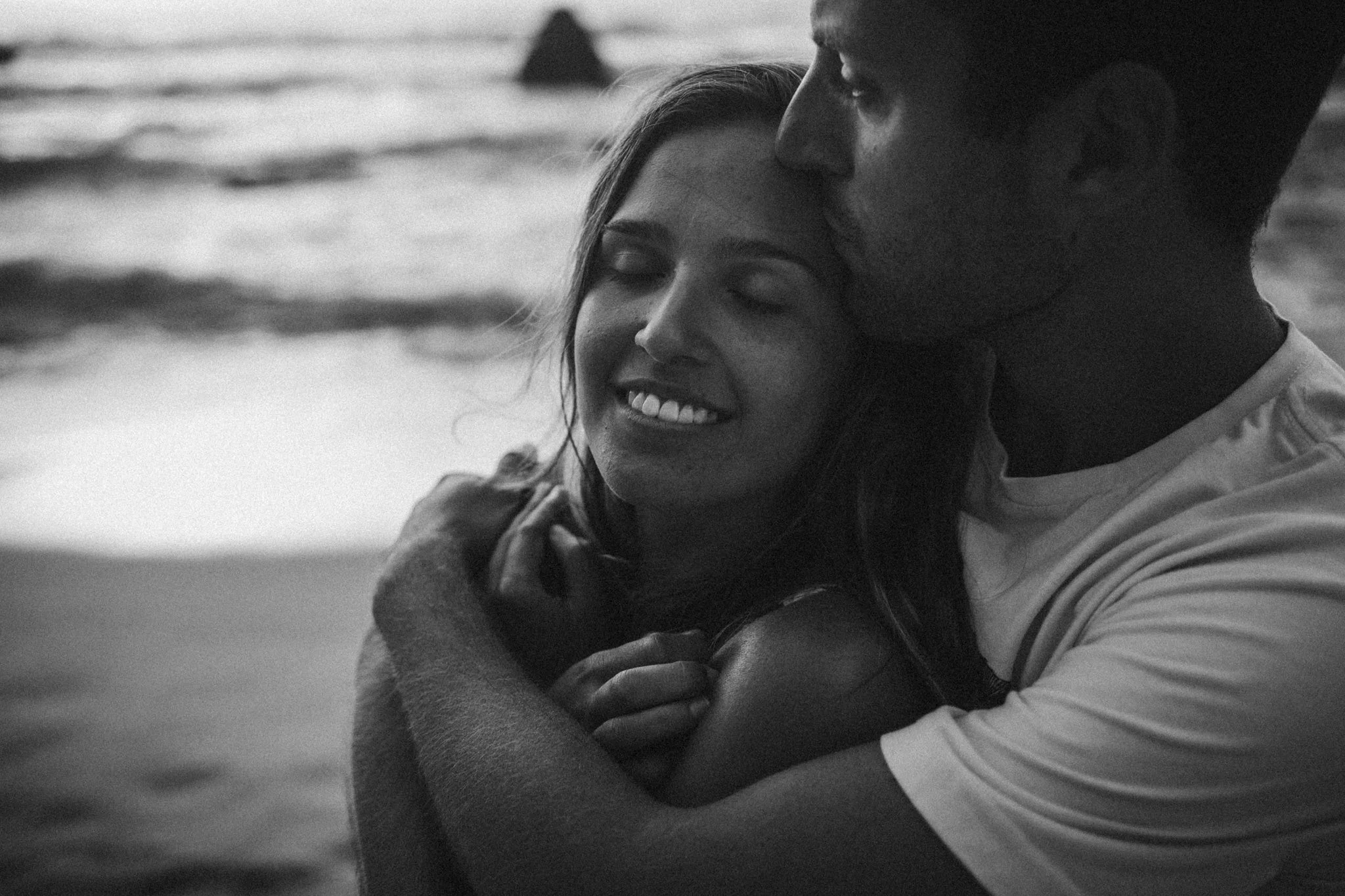 Couple hugging at a beach