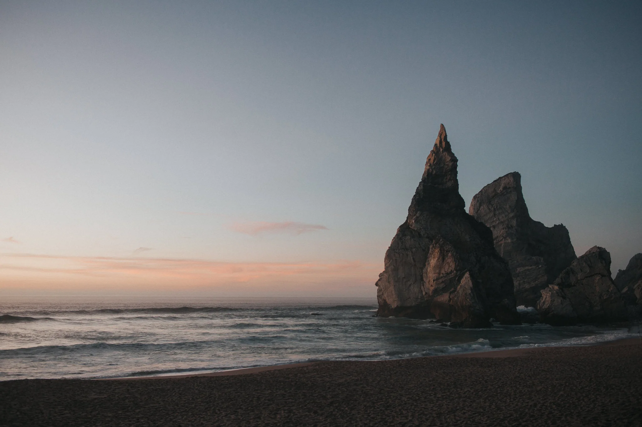 Rocks of Praia da Ursa after sunset