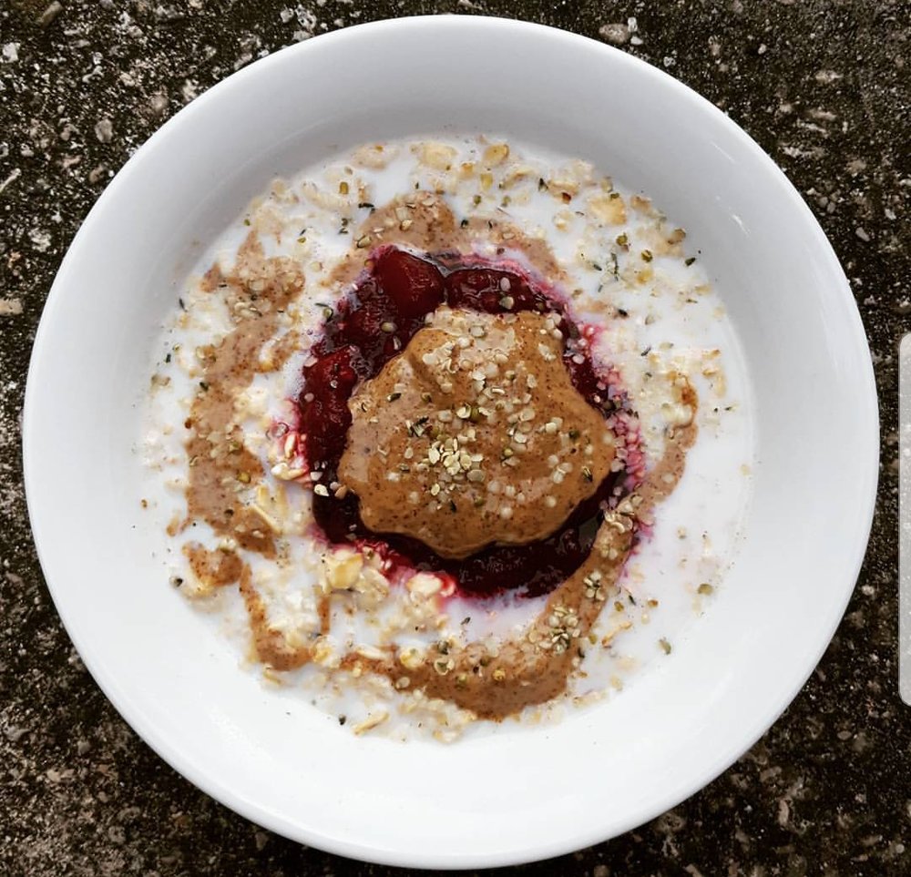 Breakfast the morning of - rolled oats with almond butter, berry compote, & hemp seeds.