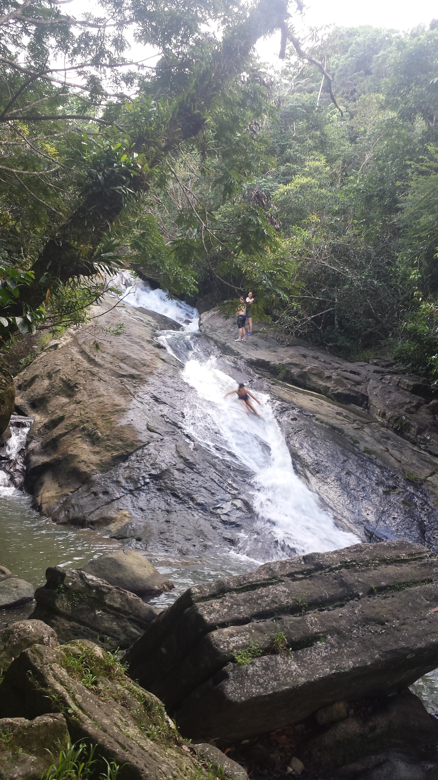 Local waterfall in Puerto Rico - pretty sure it wasn't mean to slide down. Yep that's me - "just lean forward, you'll be fine!"