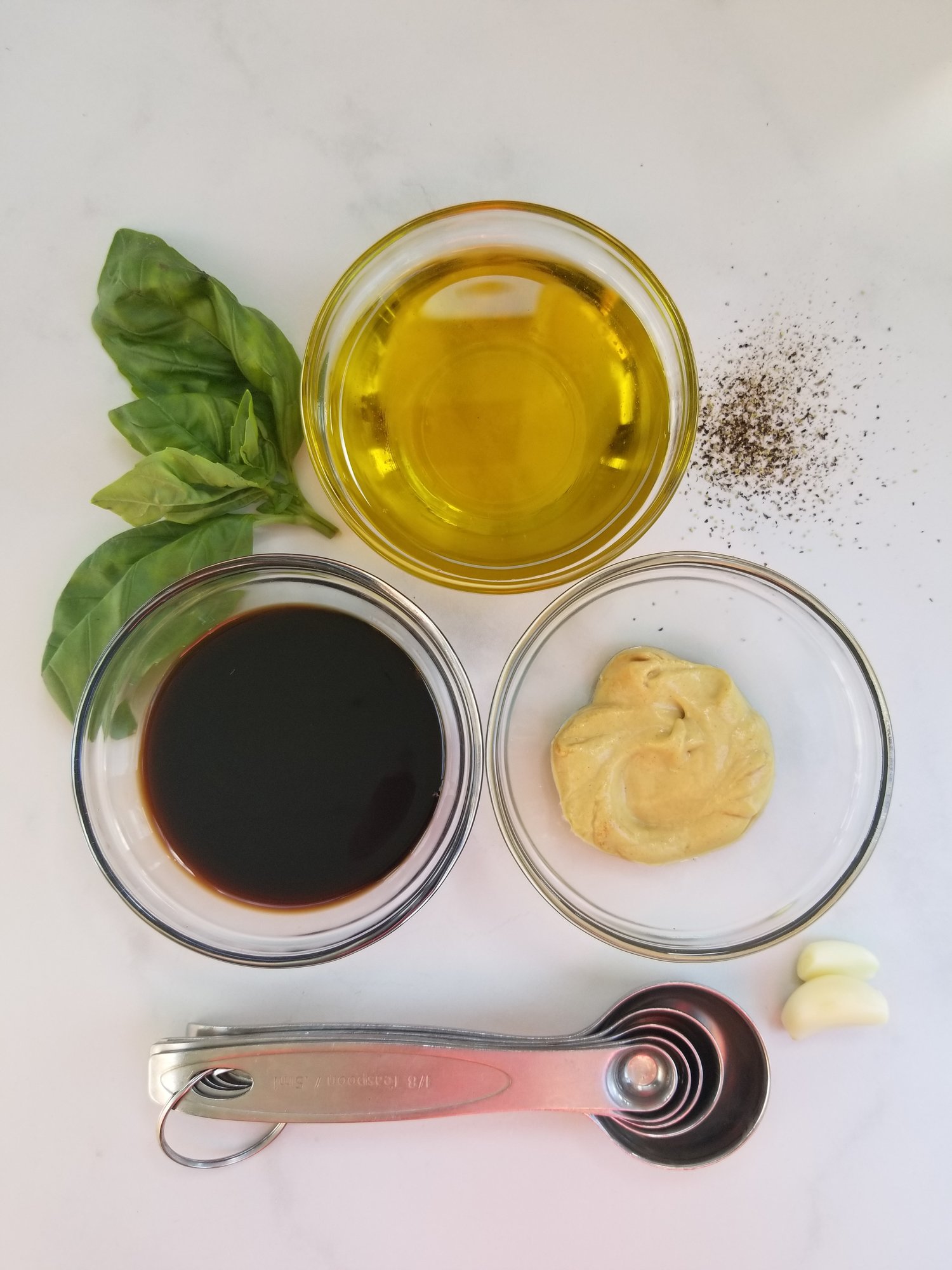 olive oil, balsamic vinegar, Dijon mustard, basil, black pepper, garlic