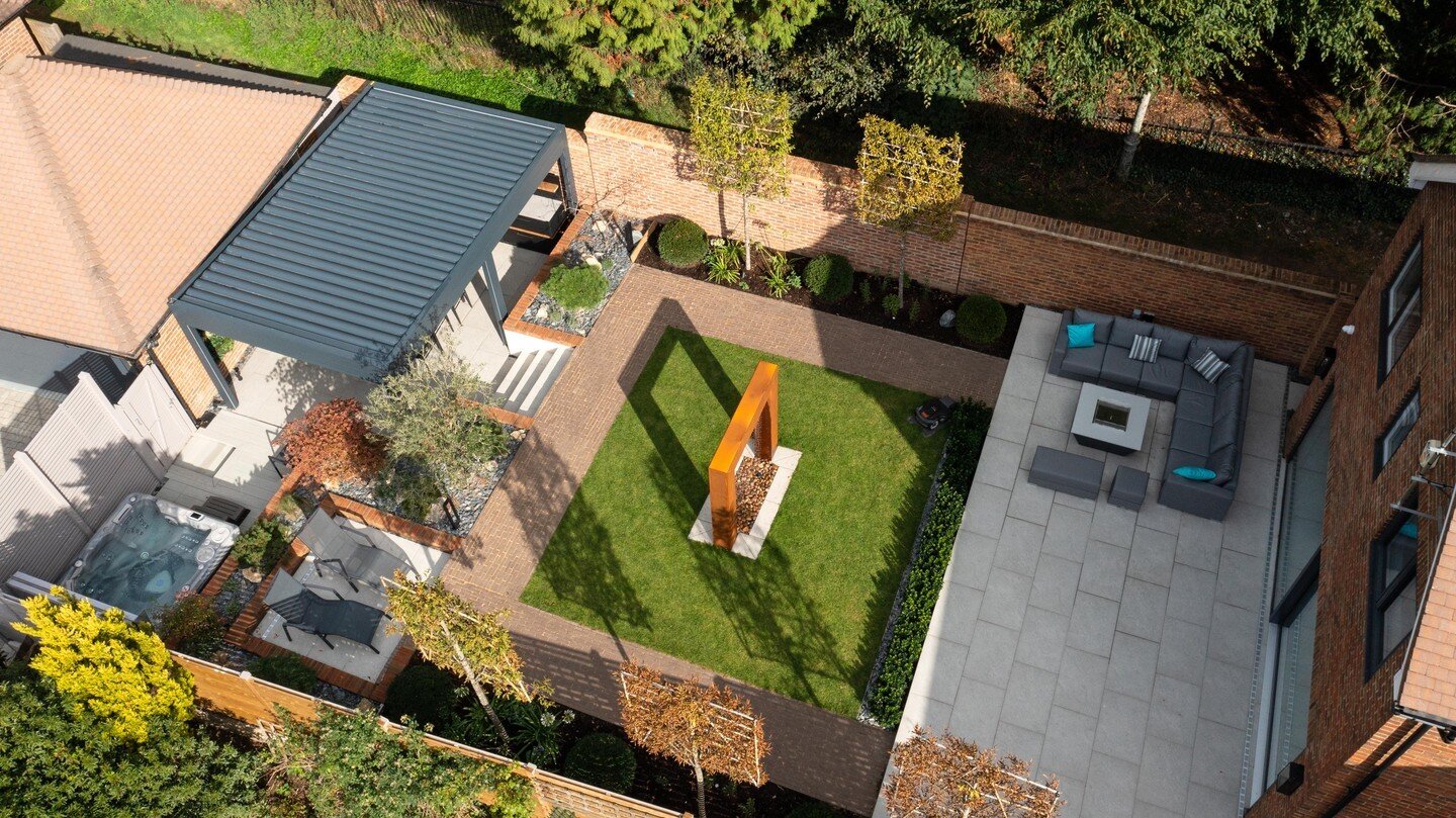 An overhead view from our drone in Sevenoaks. Here you can see almost all of the different areas we have created in this garden: sun spots, casual seating, dining, cooking, and relaxing, all of which are both beautiful to look at and practical to use