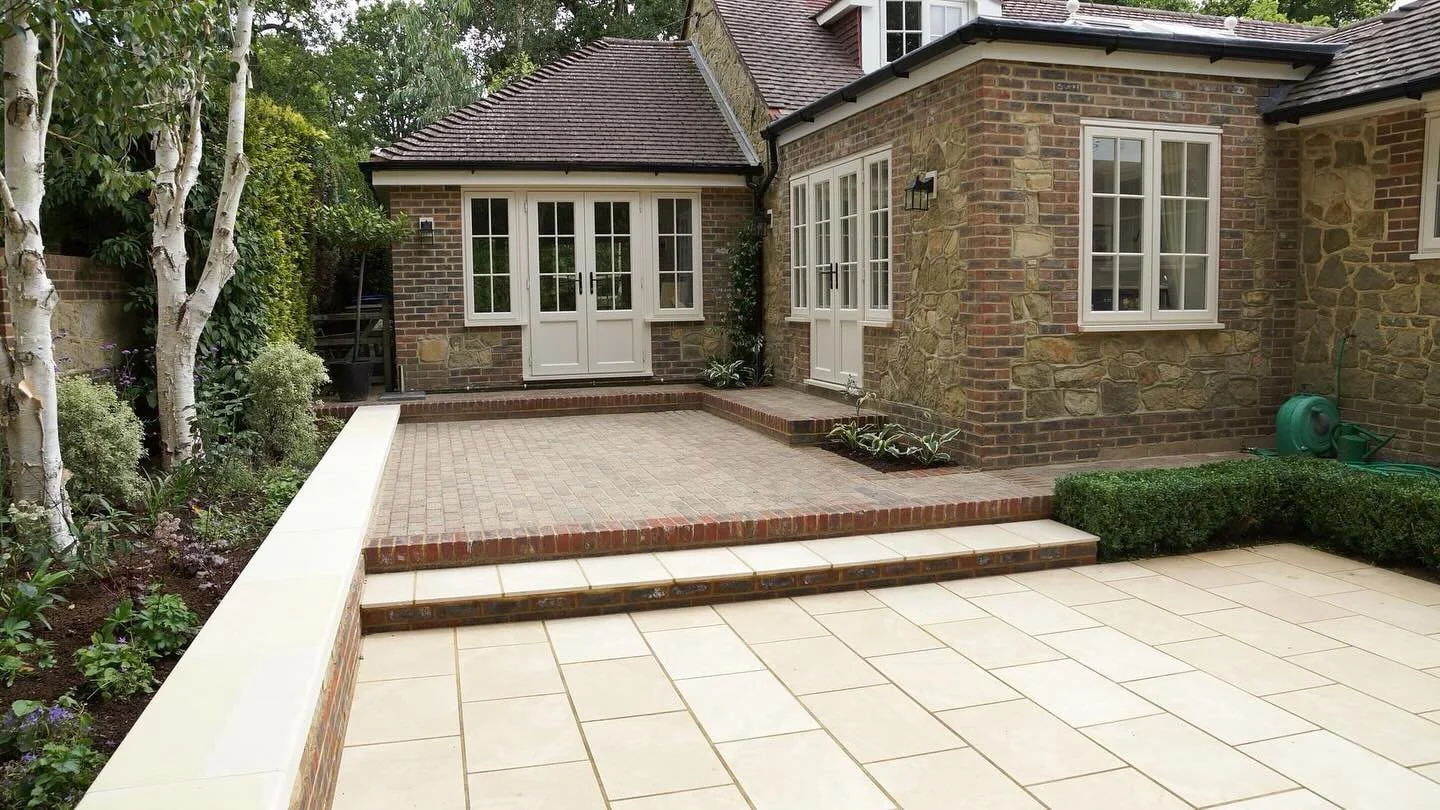When planning your outside space, it is really important to tie in materials, colours and textures that will complement or match your property. 

This can be as easy as matching brick work, using render, or finding slabs that highlight key features o