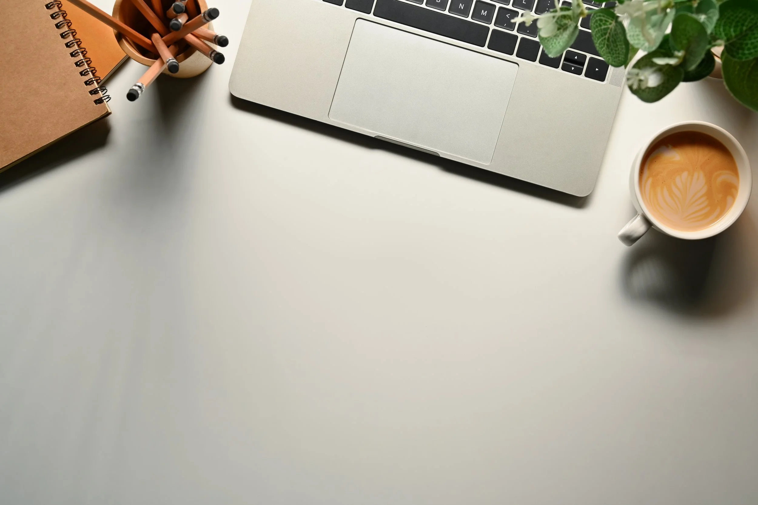 simple-workspace-with-laptop-notepad-coffee-cup-2024-11-27-01-52-49-utc.jpg