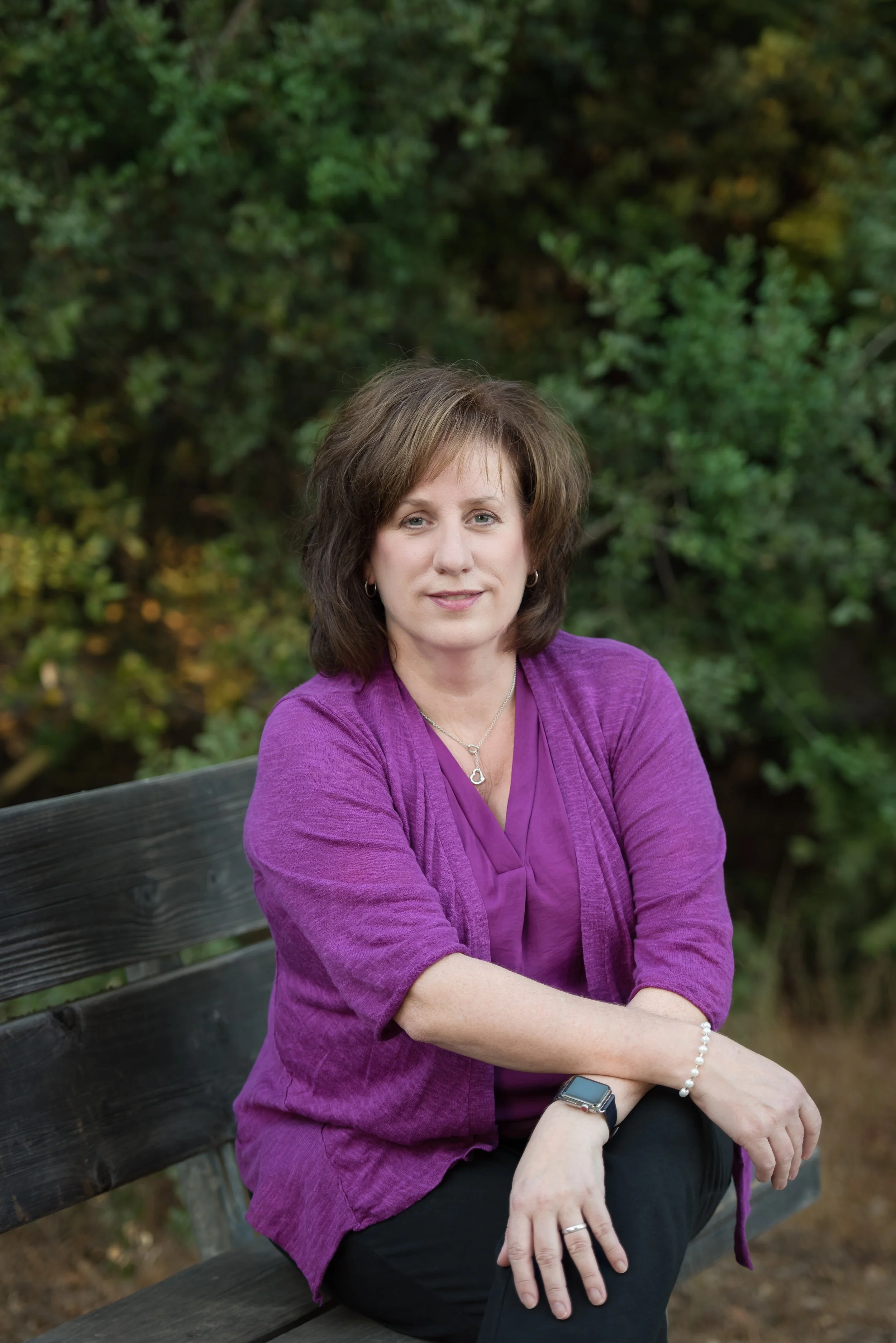 headshot on a park bench 