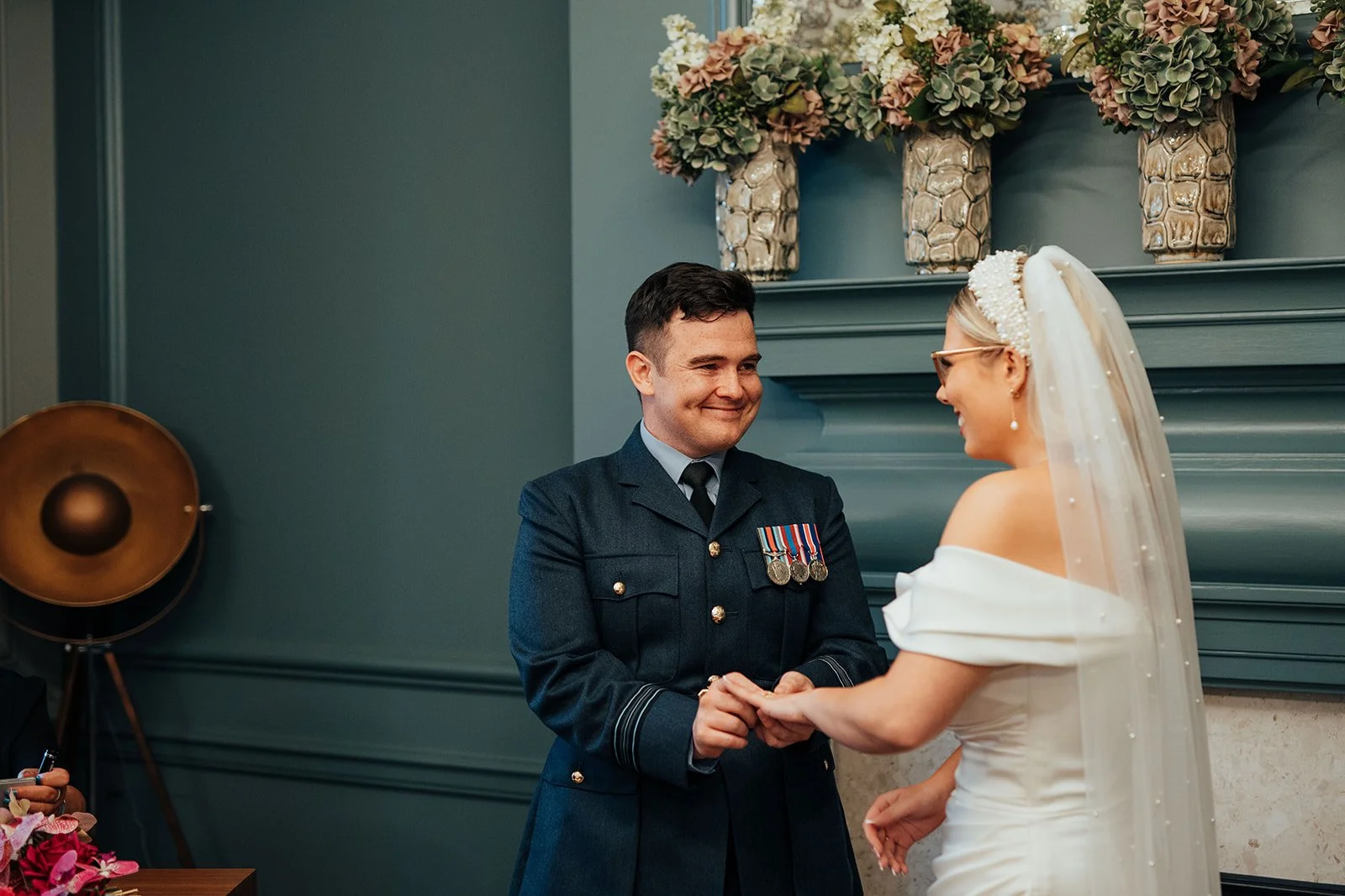 Bride and Groom exchanging rings in the Knightsbridge Room at Old Marylebone Town Hall