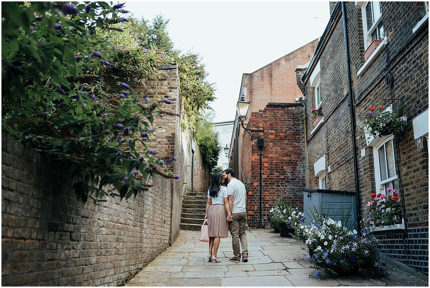 Couple walking on narrow London streets during photo shoot