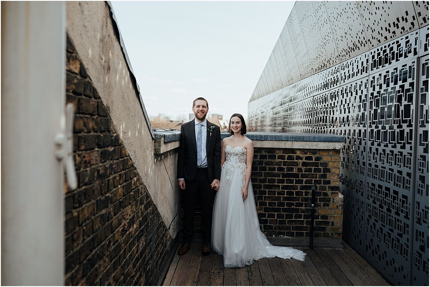 Bride and Groom on roof terrace at Bethnal Green Town Hall hotel