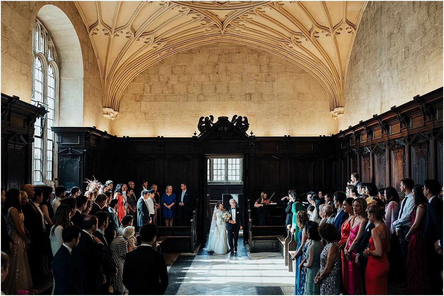 Bride entering ceremony at Bodleian Library Oxford