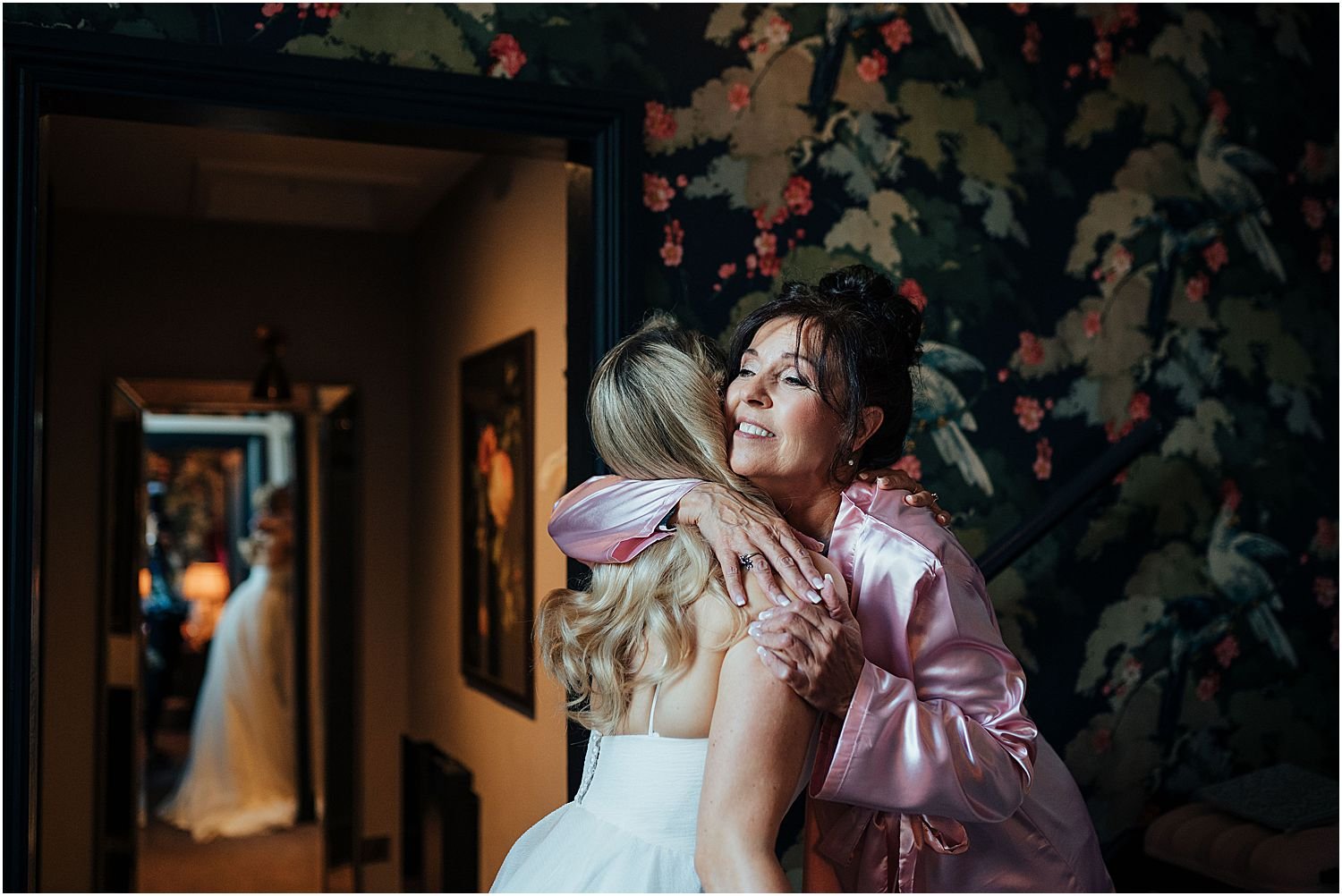 Bride and mother hugging