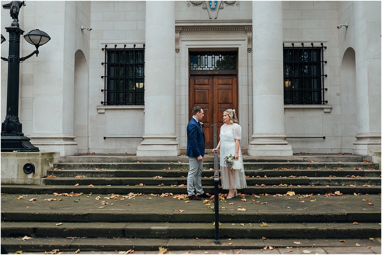 Married couple on streets of London in autumn