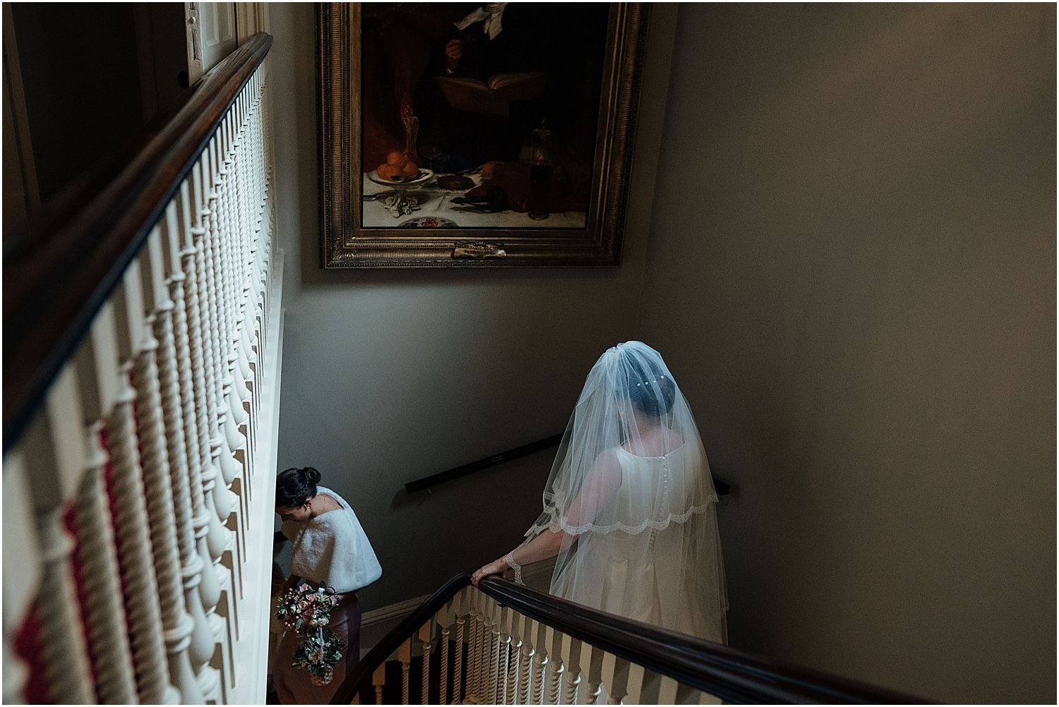 Bride walking down staircase at Brooks's