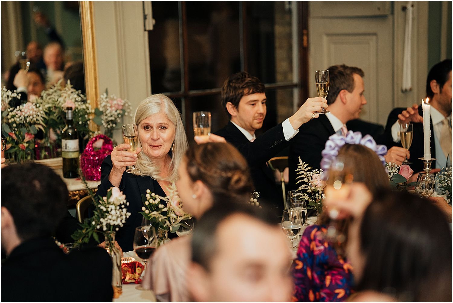 Wedding guests toasting during speeches